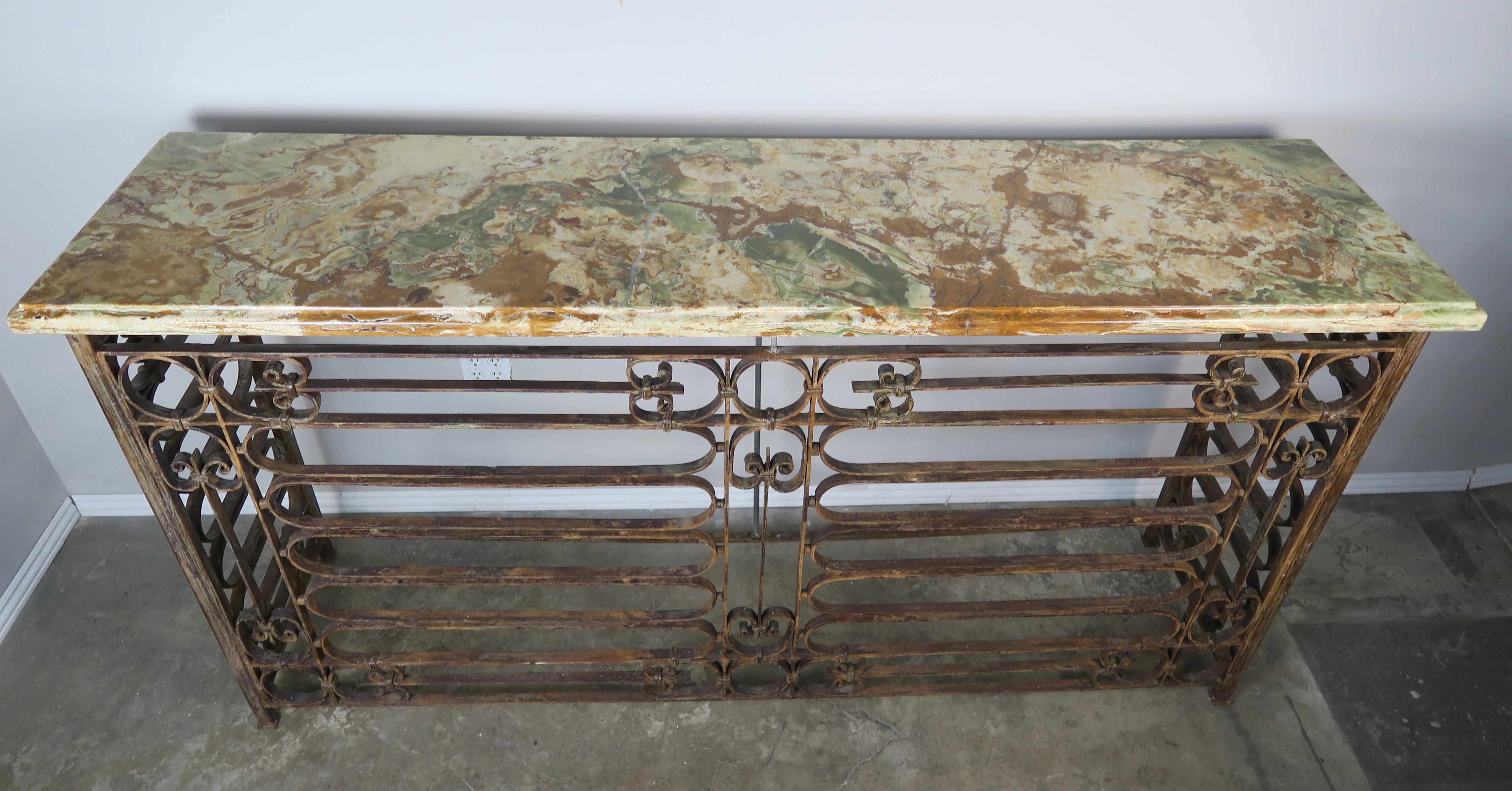 Monumental French Art Deco style wrought iron console with thick onyx top with single ogee and bullnose detail, circa 1930.
 