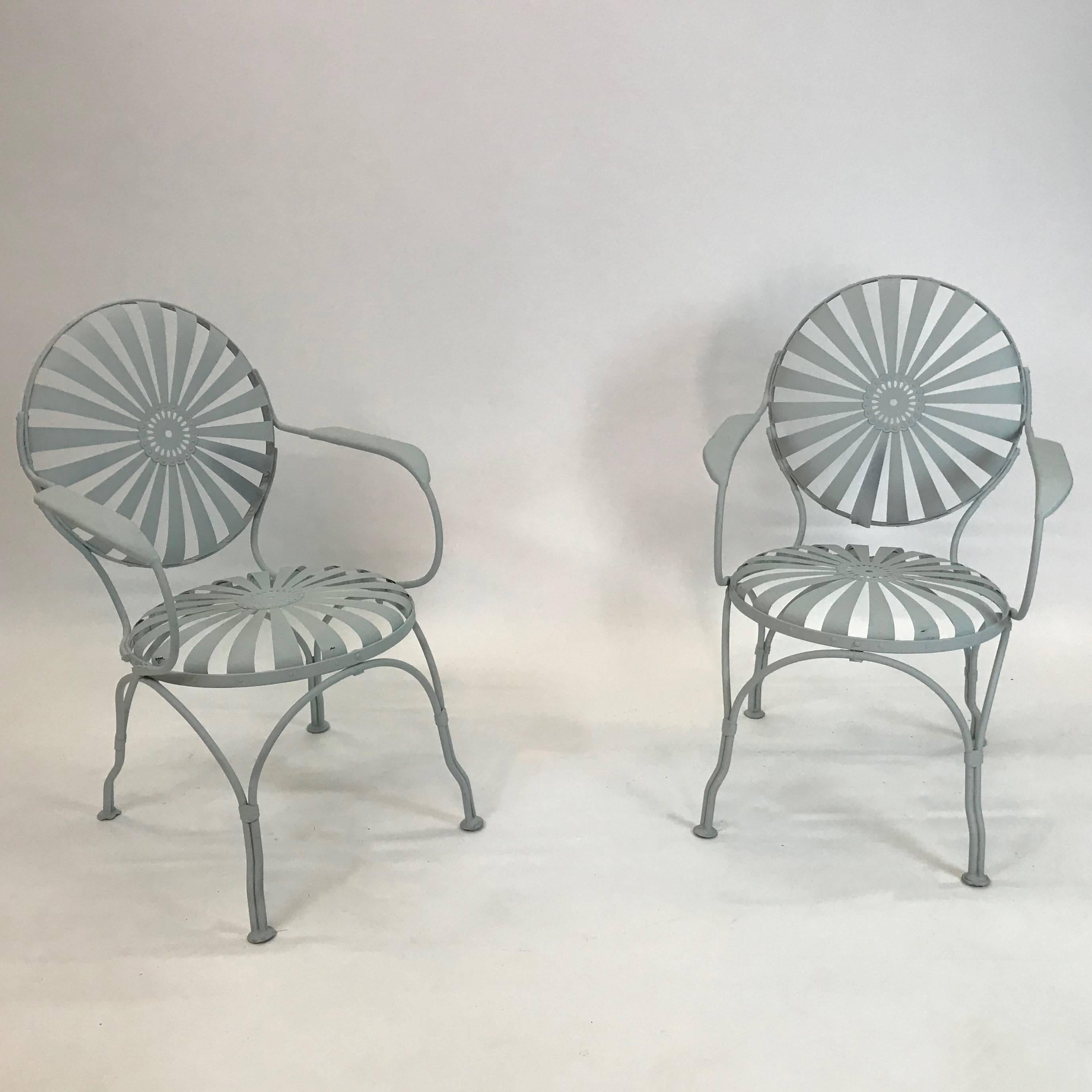 Pair of French Art Deco, painted steel, garden patio armchairs by Francois Carre´, circa 1930s feature slat steel, sunburst motif seats and backs in a matte powder blue.

 