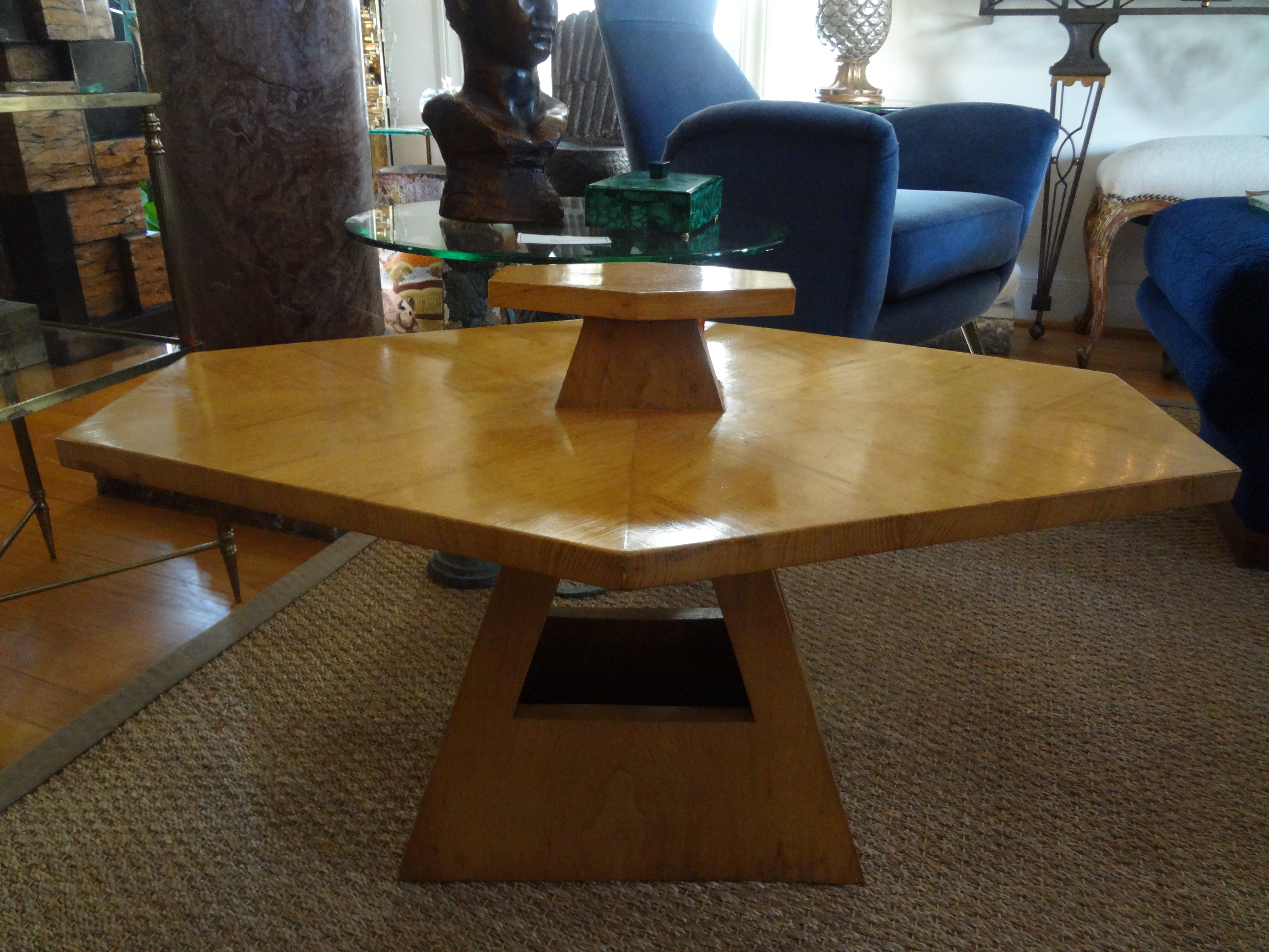 French Art Deco Table Attributed To Jules Leleu.
This handsome period French Art Deco table features an unusual geometric design with a handle and an open base design.
This versatile French table, made of Sycamore can be used as a cocktail table,