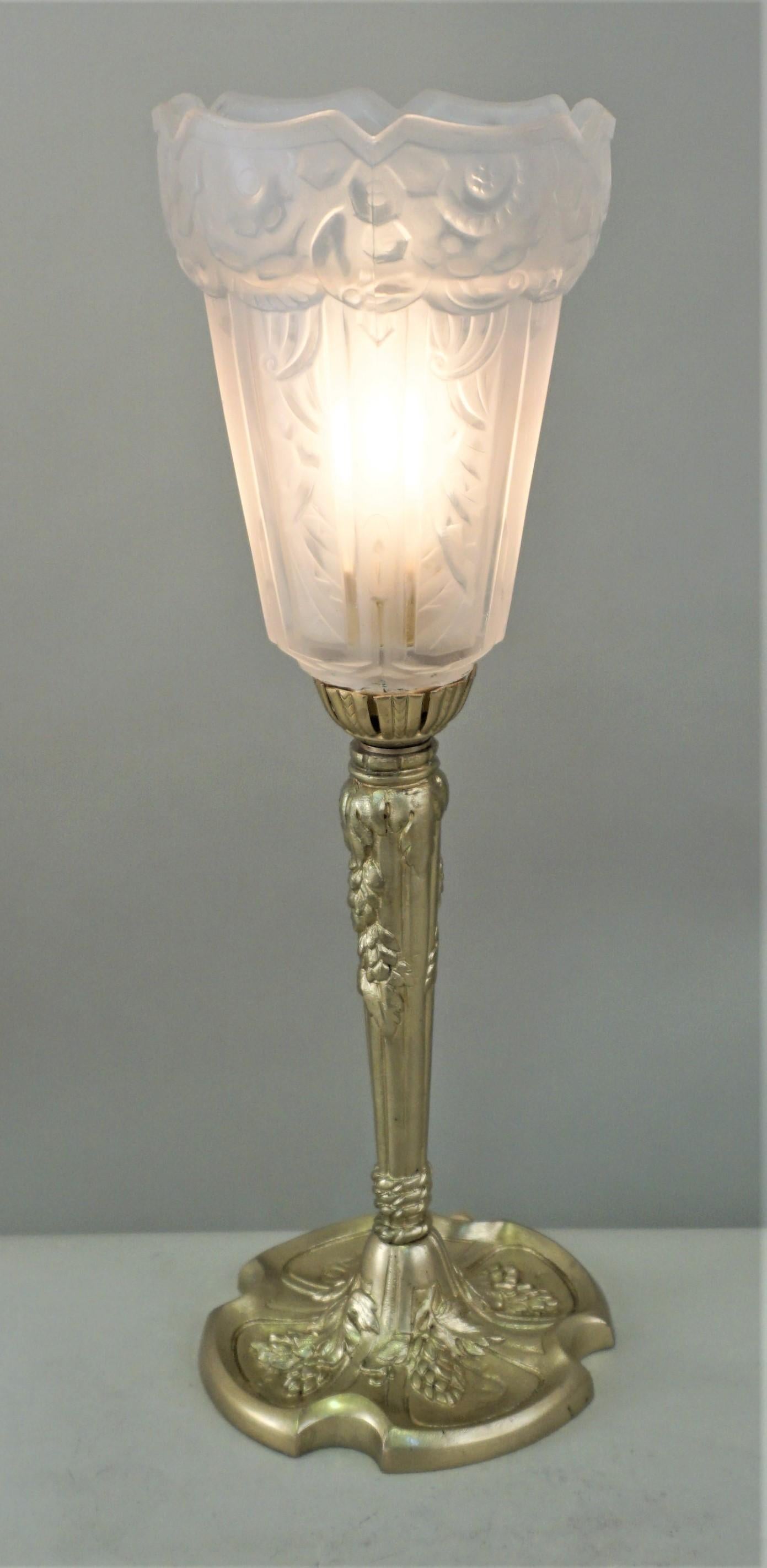 Clear frost glass upright shade with elegant bronze base Art Deco table lamp.