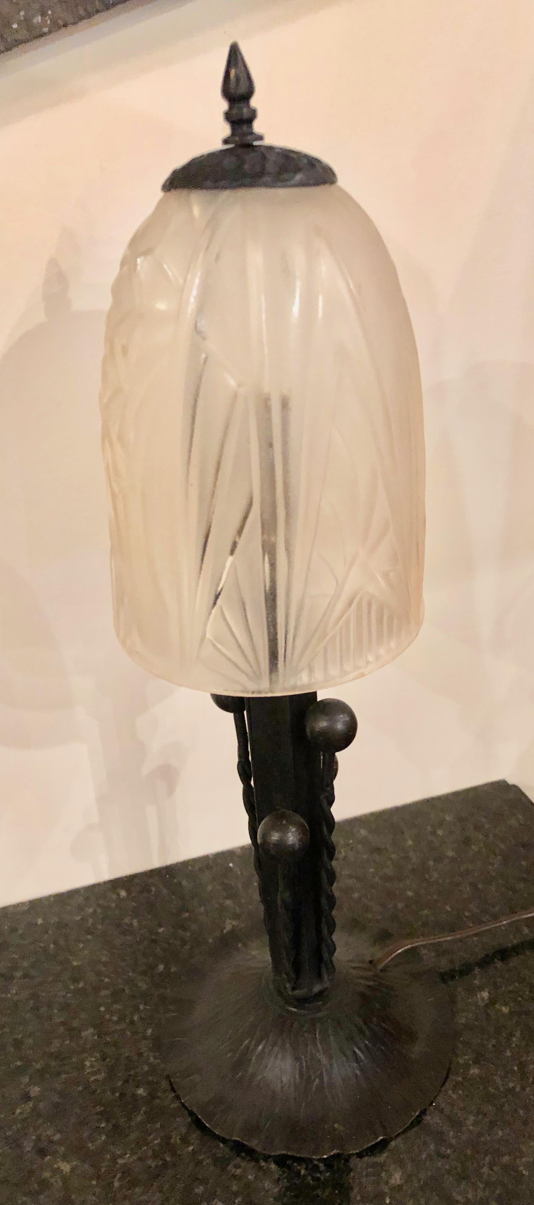 Unique French table lamp with stylized moulded glass after Degue or Muller Freres. Simple elegant shape and design. Rewired with original style on or off switch and also has original French style B-22 socket. Designed circa 1925-1930 with an unusual