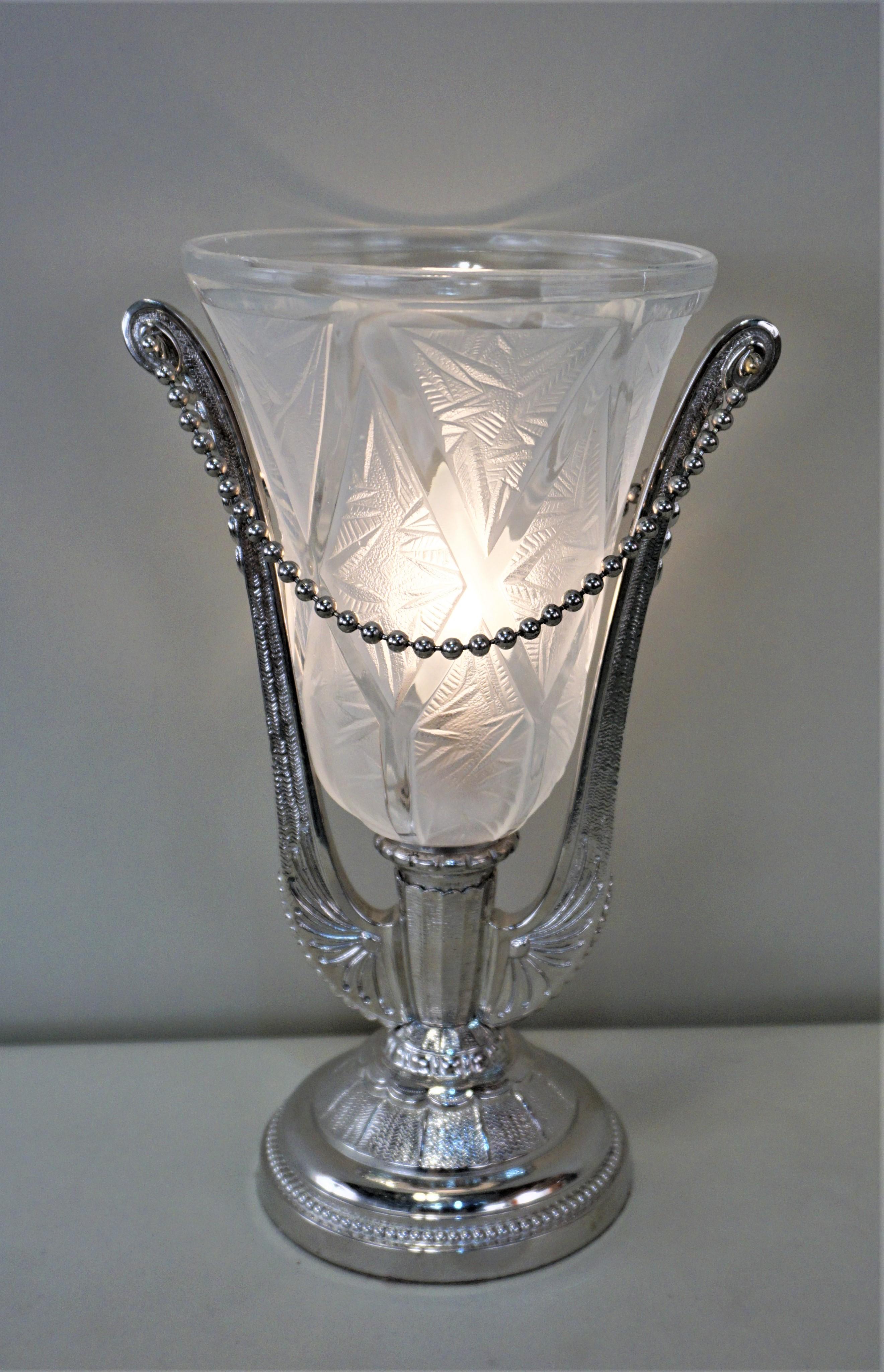 Torchiere style clear texture frost glass shade with nickel on bronze base table lamp.