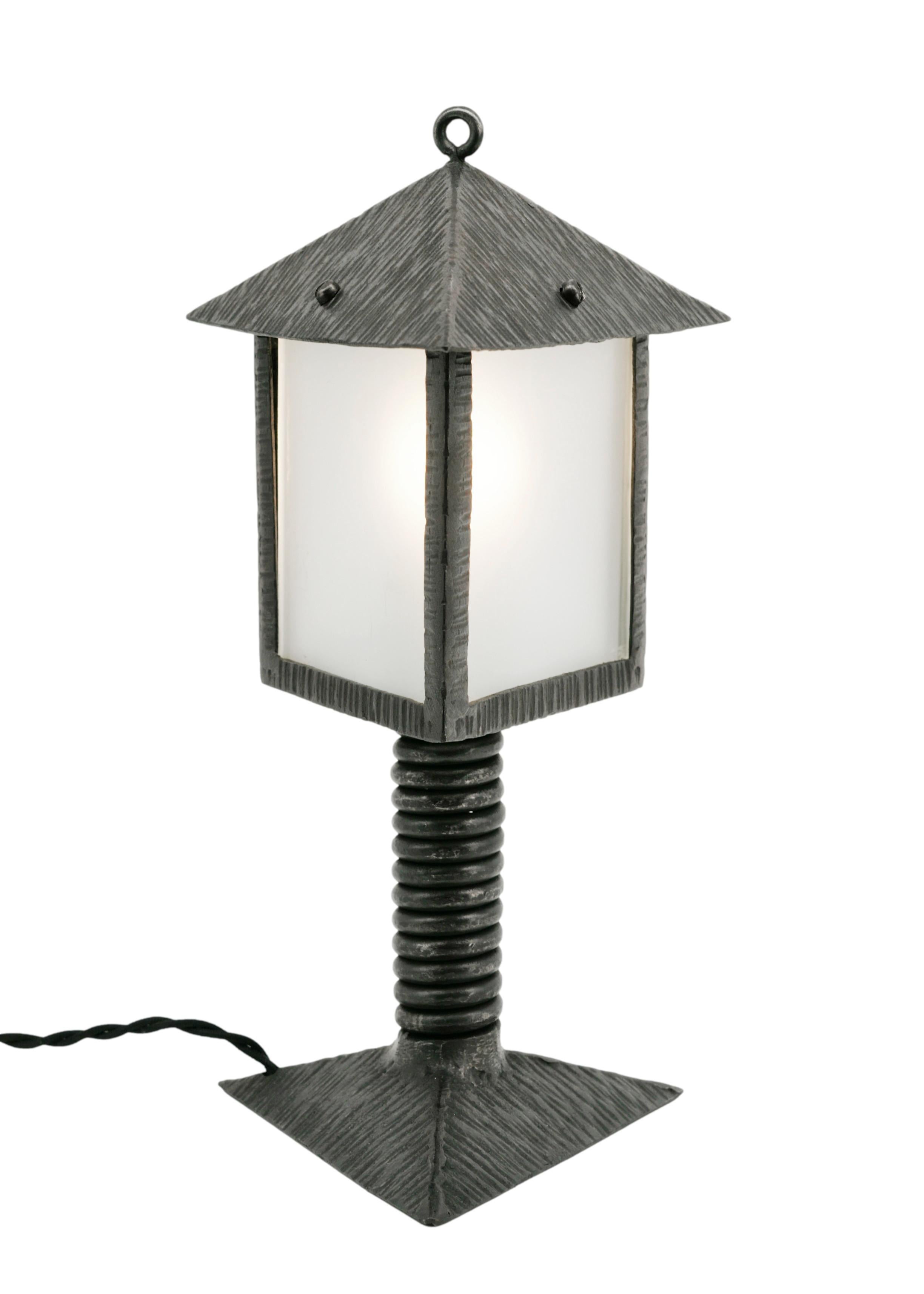 French Art Deco table lamp / lantern, France, 1920s. Can be used as a table lamp or lantern. Wrought-iron and glass. Height: 13