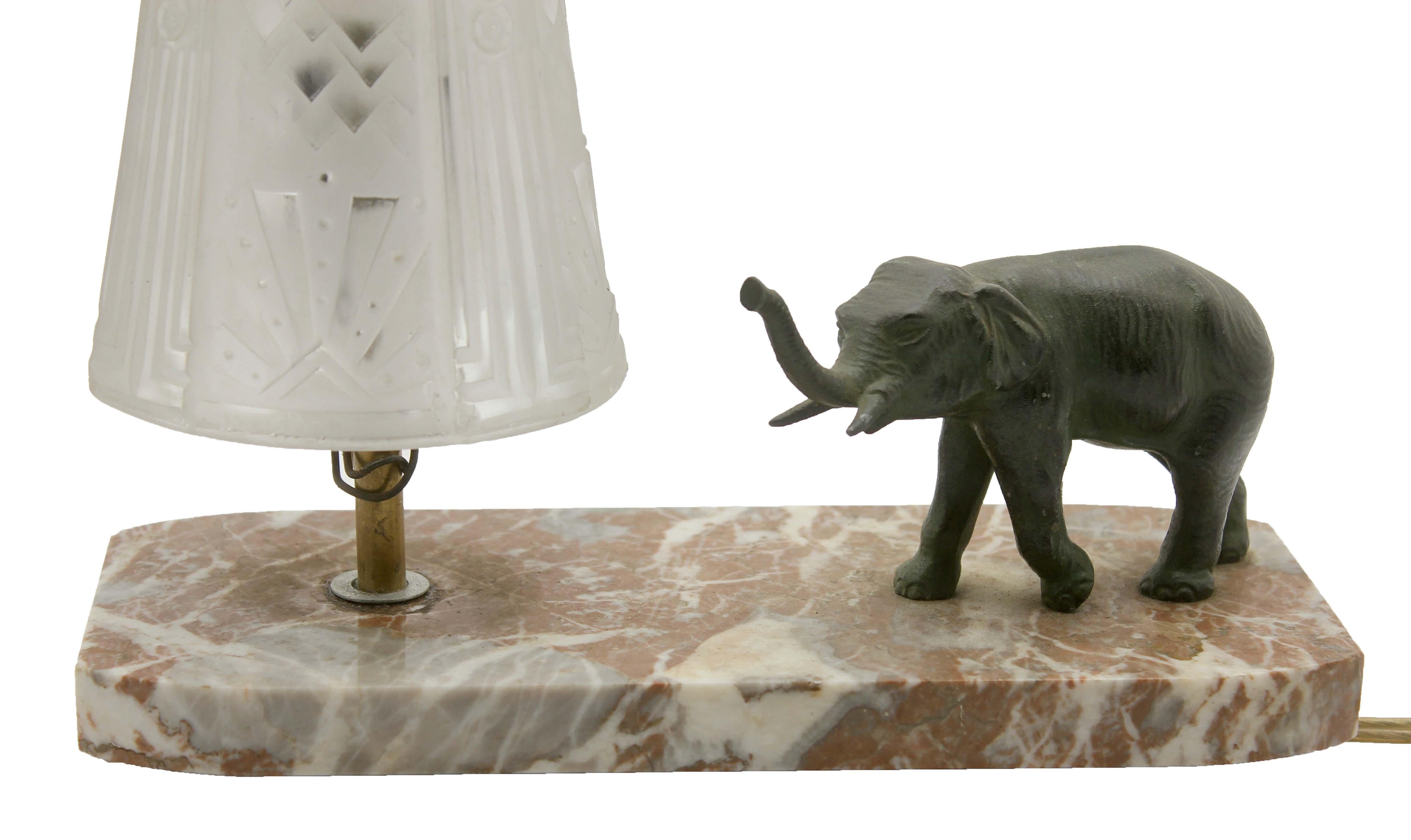 Stunning French Art Deco table lamp signed by Muller Frères. Gorgeous glass globe shade.
With bronze elephant motif. Sitting on a marble base. 
In excellent condition and in full working order. And new fitting E14 

The piece is in excellent and