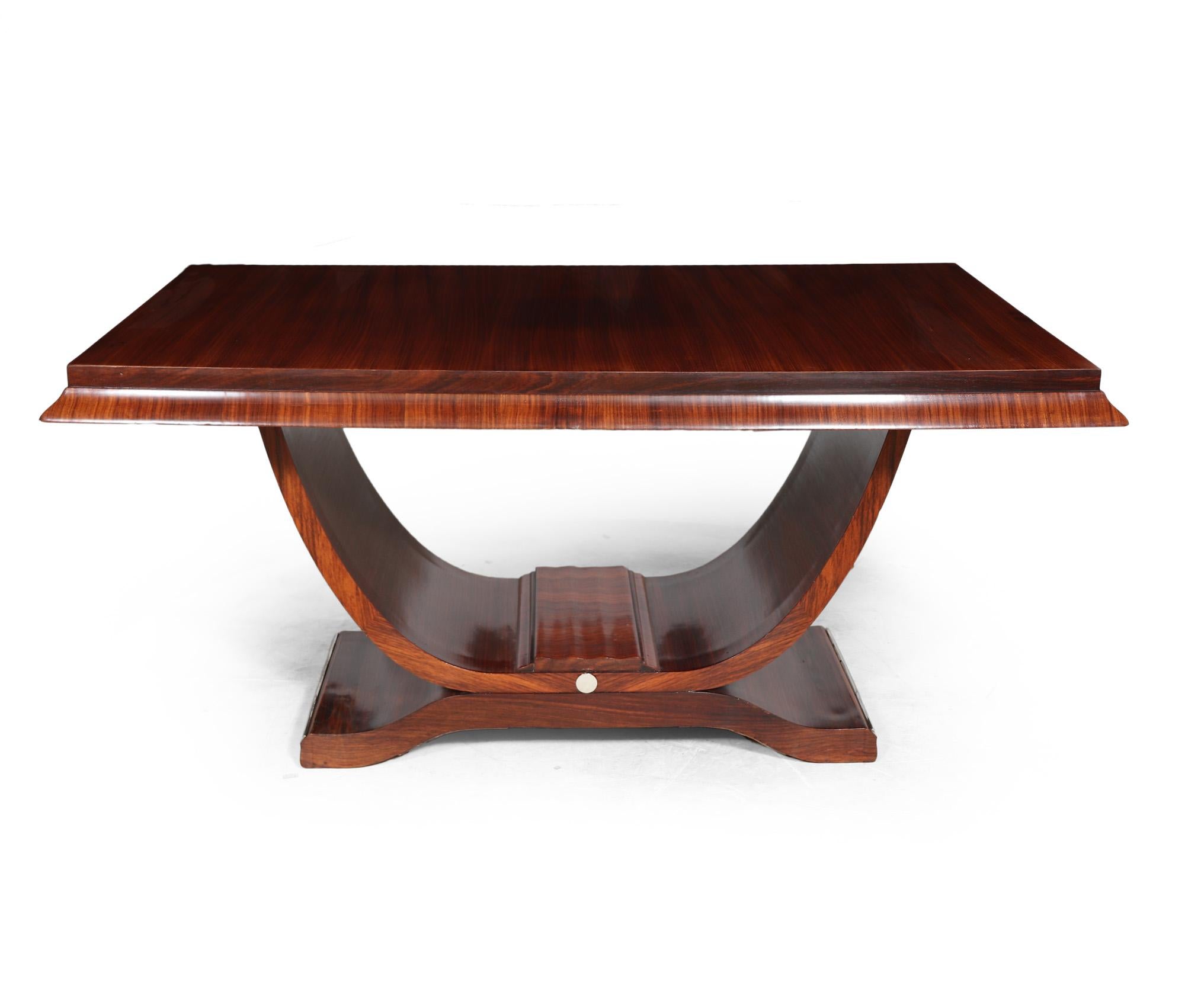 ART DECO TABLE WITH U BASE
A French u base dining table to seat up to six people produced in the 1920’s, in rosewood the table has a good sized rectangular top with shaped edging a u shaped upright support and a gently curved base with chromed