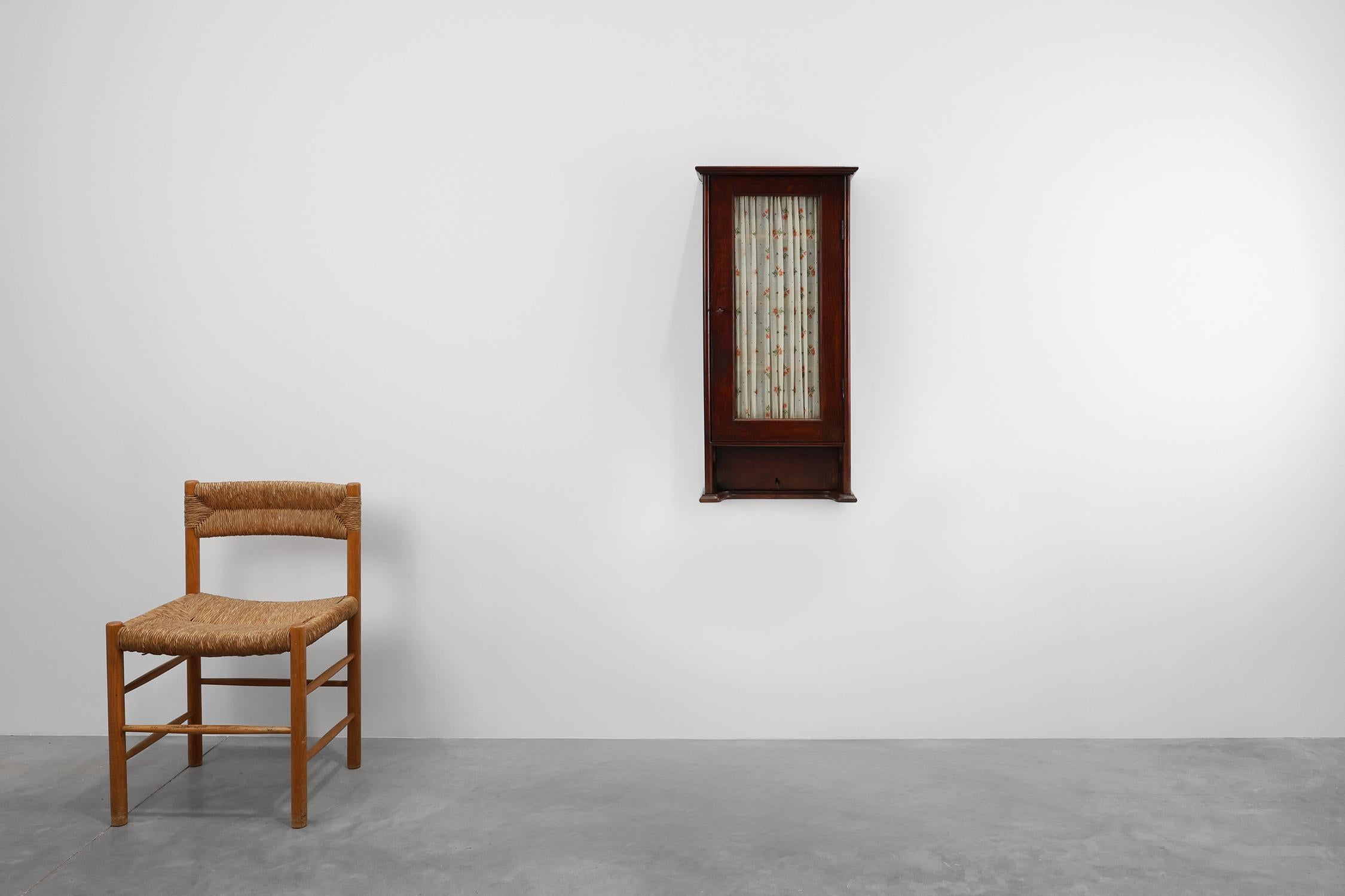 Early 20th Century French Art Deco tall cabinet with glass door and hidden compartiment, ca. 1920 For Sale