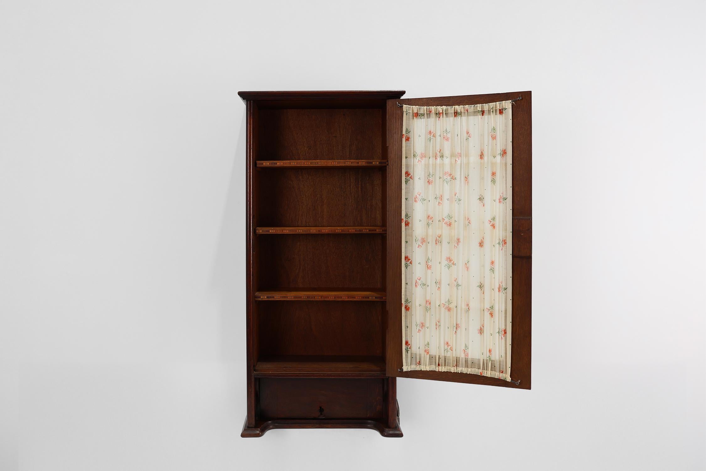 Fabric French Art Deco tall cabinet with glass door and hidden compartiment, ca. 1920 For Sale