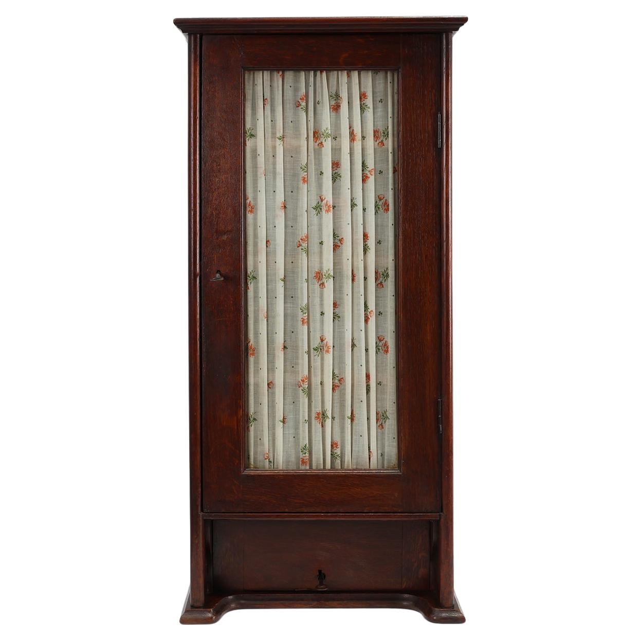 French Art Deco tall cabinet with glass door and hidden compartiment, ca. 1920 For Sale