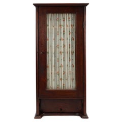 French Art Deco tall cabinet with glass door and hidden compartiment, ca. 1920