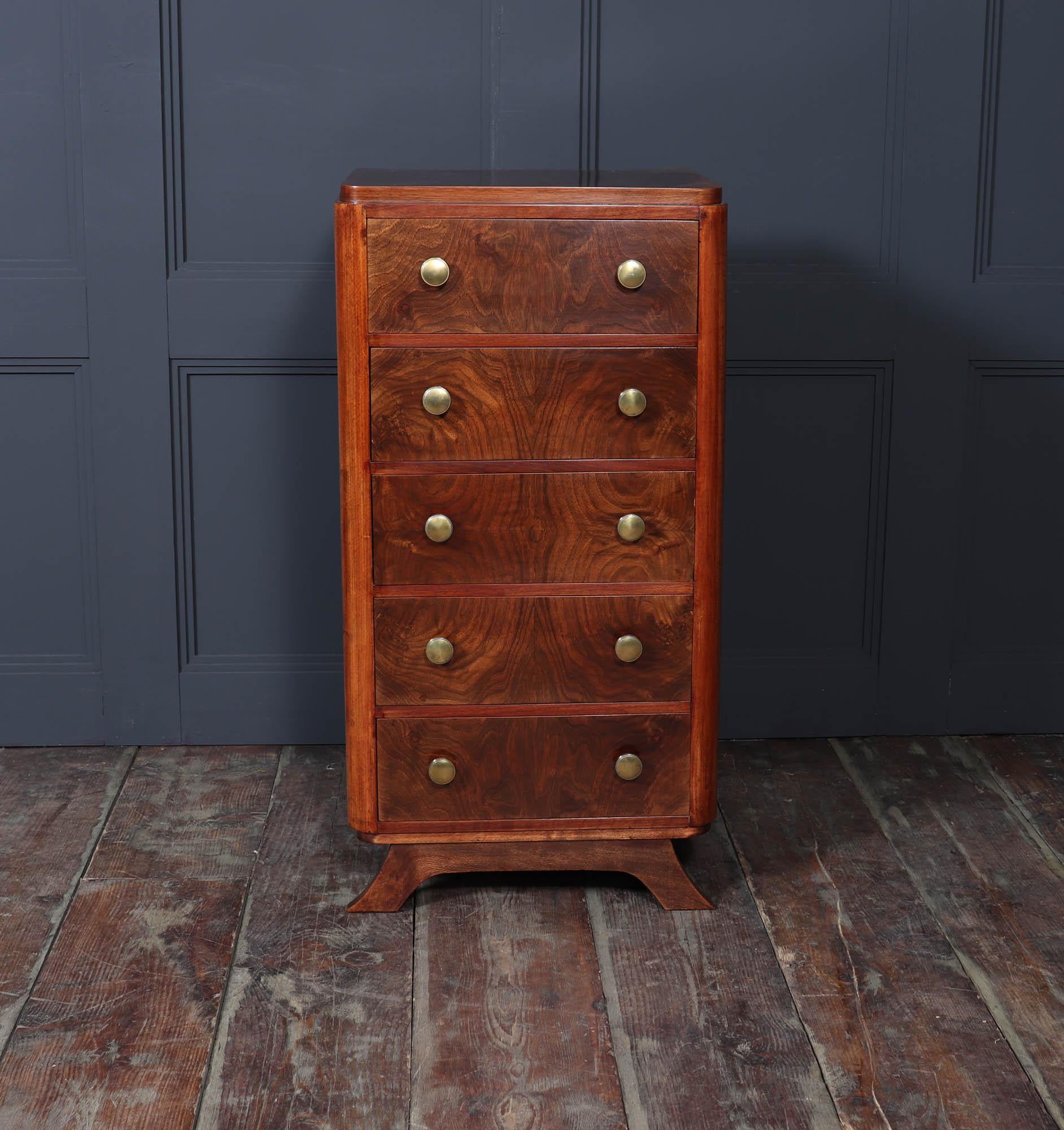 Art Deco Chest of Drawers 
A beautiful French Art Deco chest of drawers, a timeless piece from the 1920s that embodies the sophistication of Art Deco design. Crafted from quality figured red walnut, this stunning chest features five drawers that run
