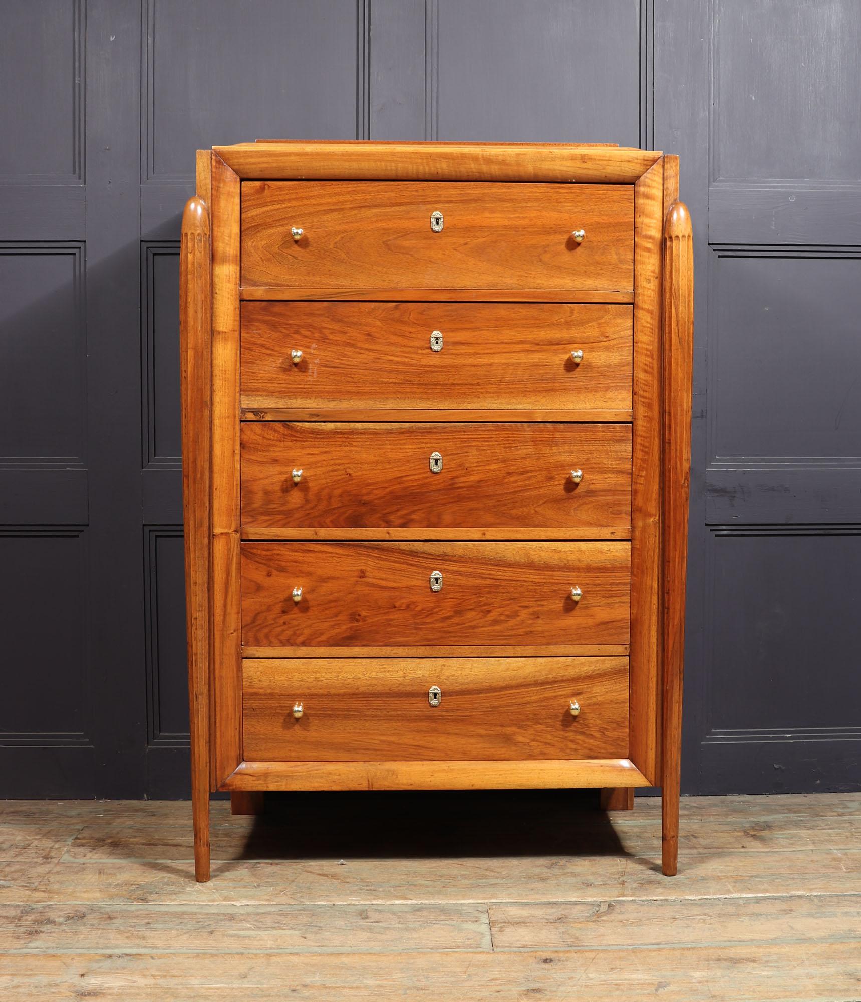 ART DECO WALNUT CHEST OF DRAWERS
An exceptional style and quality French Art Deco chest of drawers produced in France in the 1920’s having five long drawers with brass ball handles and escutcheons tapered turned fluted legs and shaped rising top all