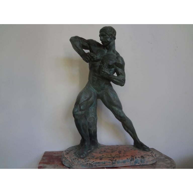 French Art Deco terracotta athlete sculpture by Henri Bargas.
This fabulous French Art Deco patinated terracotta sculpture of a nude male athlete is signed Henri Bargas. This well executed terracotta sculpture has a patinated finish that resembles