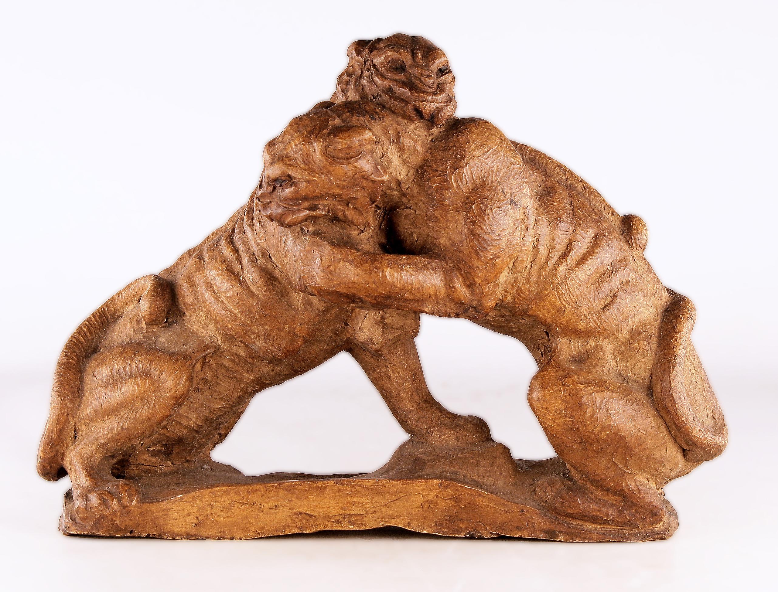 1920s french Art Déco terracota sculpture of a couple of felines/panthers fighting

By: unknown
Material: terracotta
Technique: hand-crafted, molded, carved, hand-carved, unglazed
Dimensions: 4 in x 11 in x 8 in
Date: early 20th century, circa