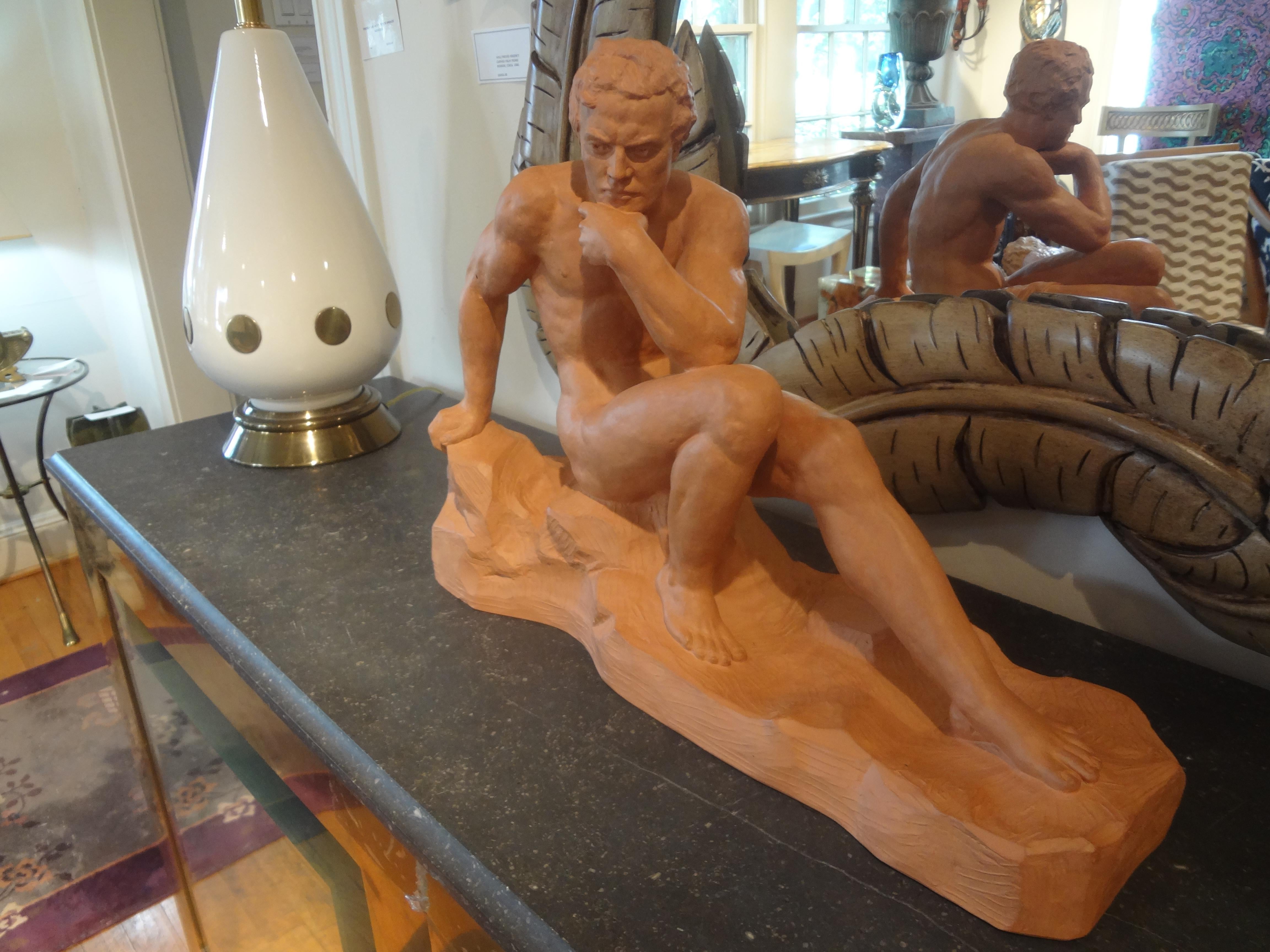 French Art Deco terracotta sculpture signed Ouline. This stunning French Art Deco terra cotta sculpture of a nude male is expertly executed with beautiful detailing by Alexandre Ouline. This is one of the best examples of his work that we have ever
