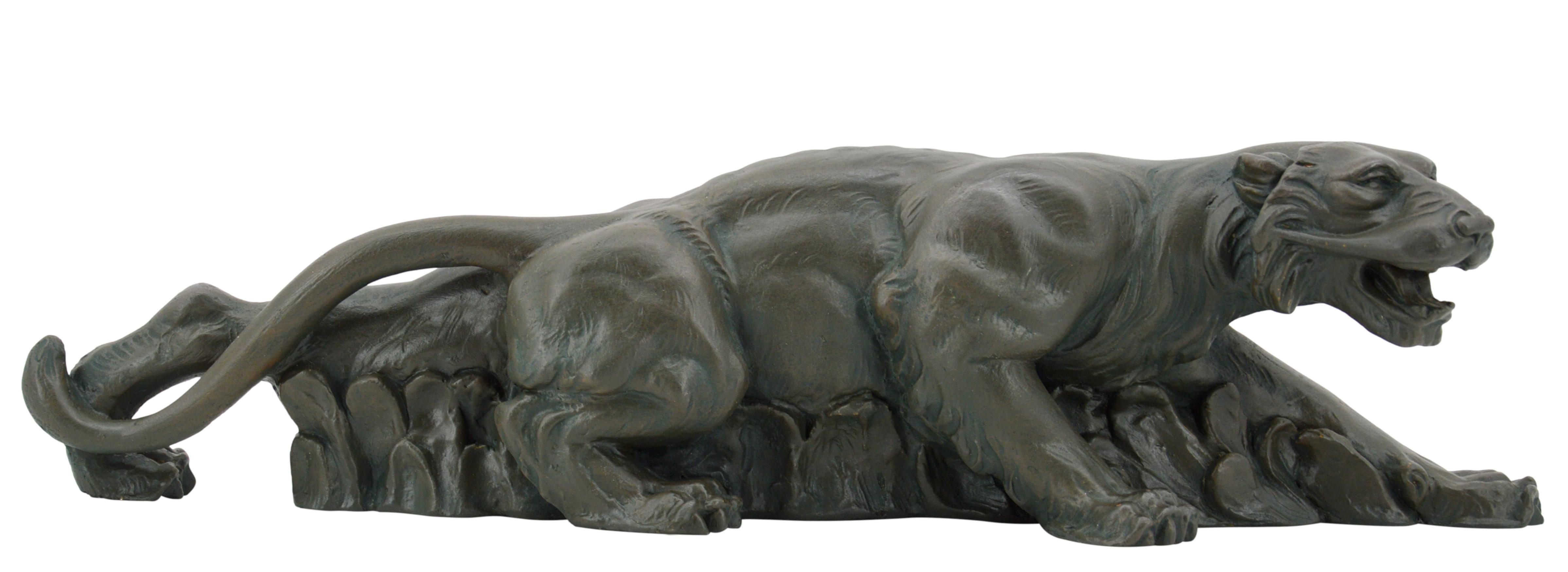 French Art Deco plaster tiger sculpture, France, 1930s. Tiger on the prowl. Old bronze patina. Measures: height : 5.1