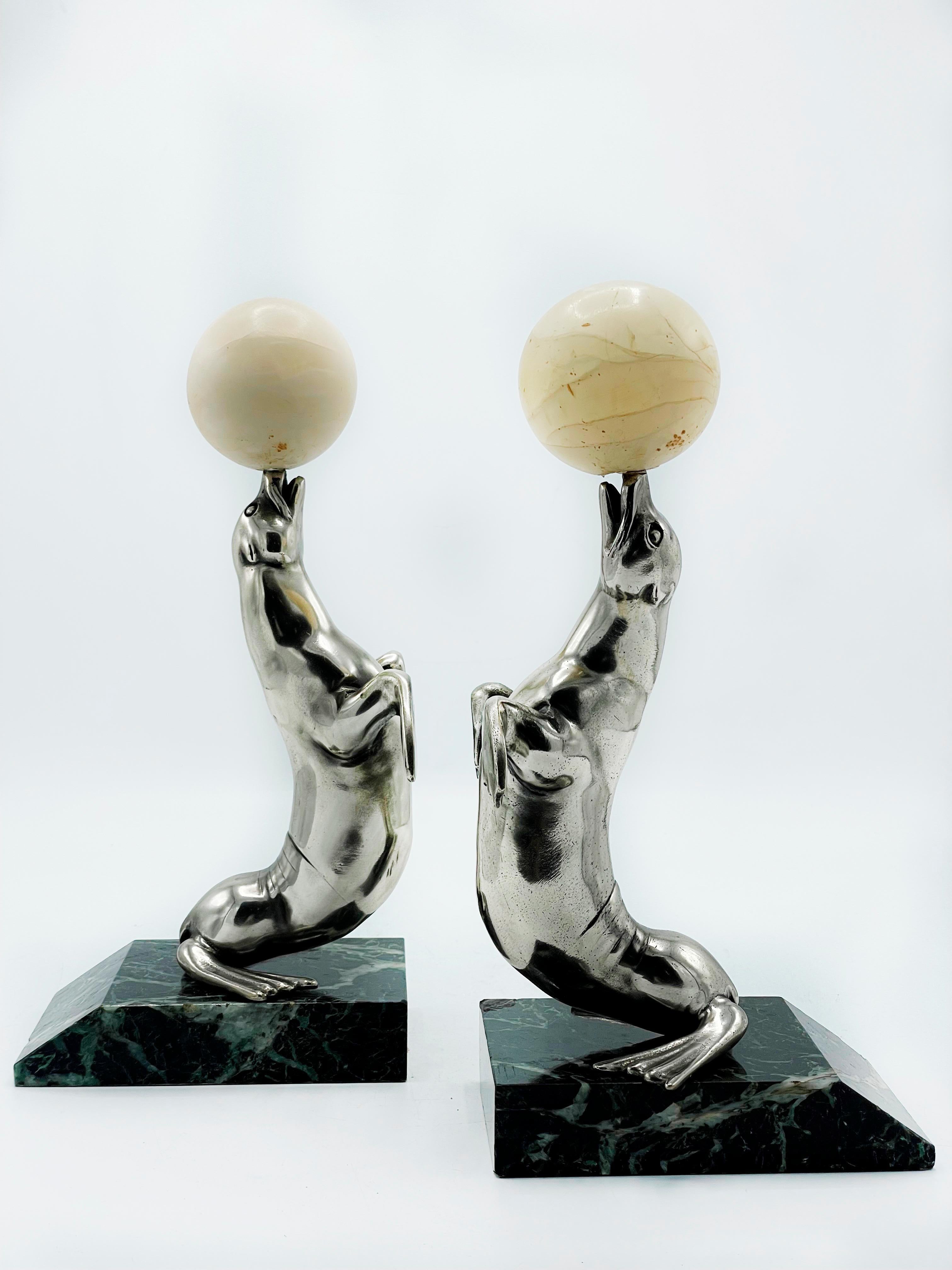 Art Deco French Marine Seal bookends, made in France, 1930s. 
Bronze and marble. Plated bronze. Marble balls.
Plated bronze. Marble balls.
Some small chips in the marble. Very good condition.