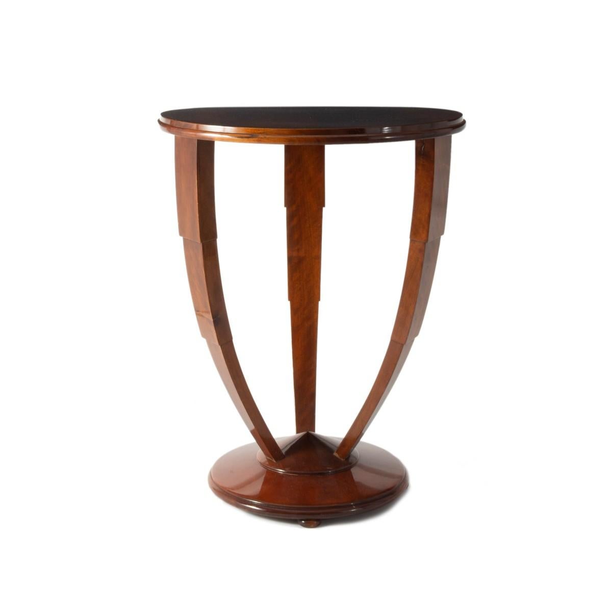French Art Deco side table with round top and tri-form base, circa 1940.