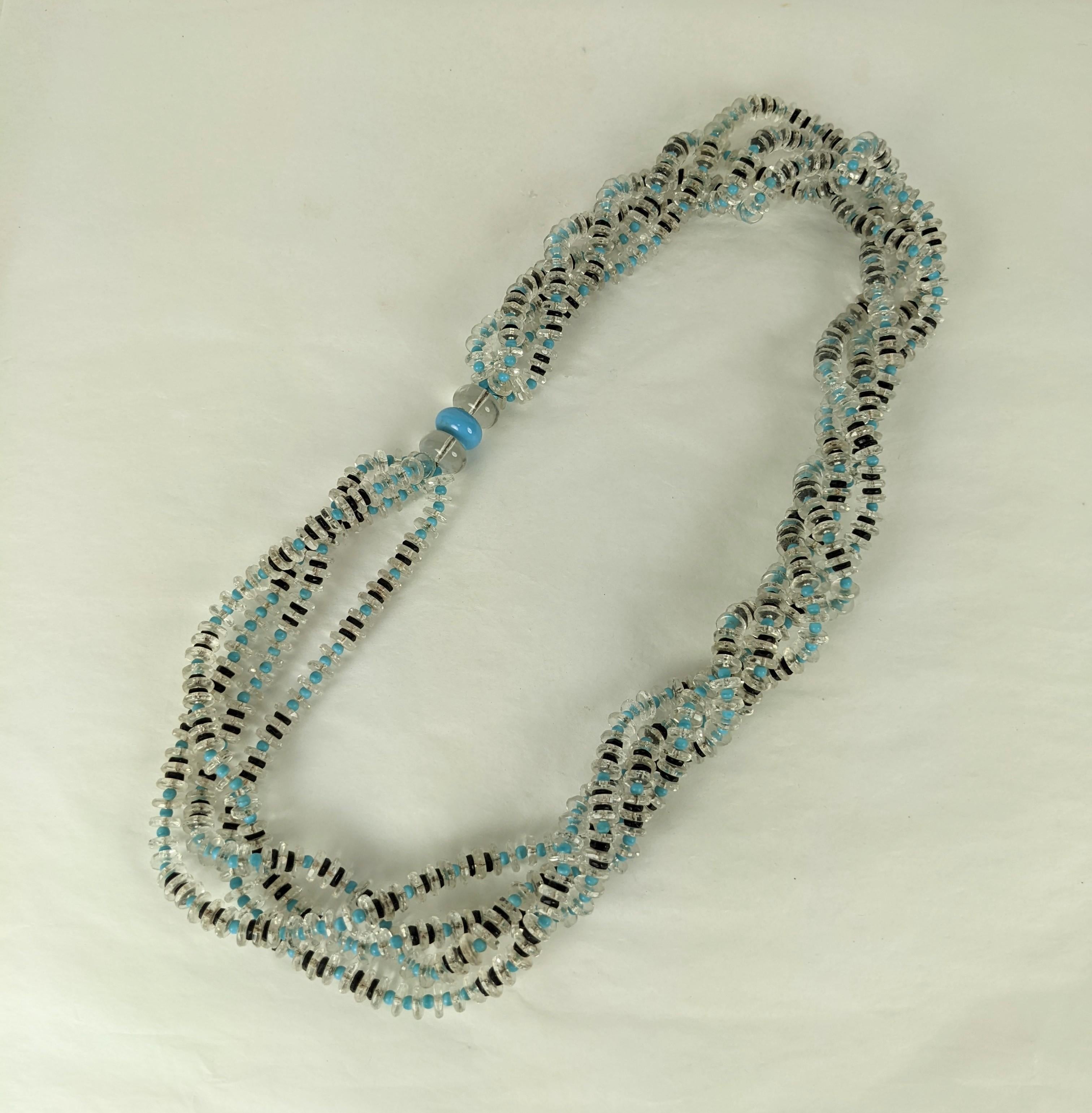 French Art Deco Twisted Crystal Rondel Necklace with turquoise and jet pate de verre spacers which slips over the head. Strands are capped by 3 large crystal and turquoise beads which can be worn at the side or on the back. 
1930's France.  26