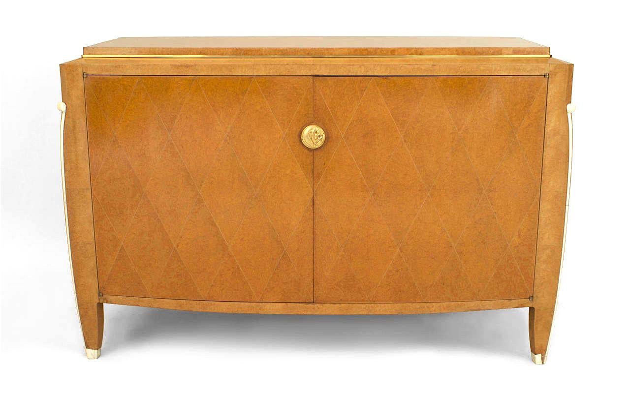 French Art Deco burled amboyna wood two door commode with bronze trim and bone detailing with diamond design brass pencil line inlay (signed: Émile-Jacques Ruhlmann. French, Paris 1879–1933 Paris).


Perhaps the most renowned French designer of his