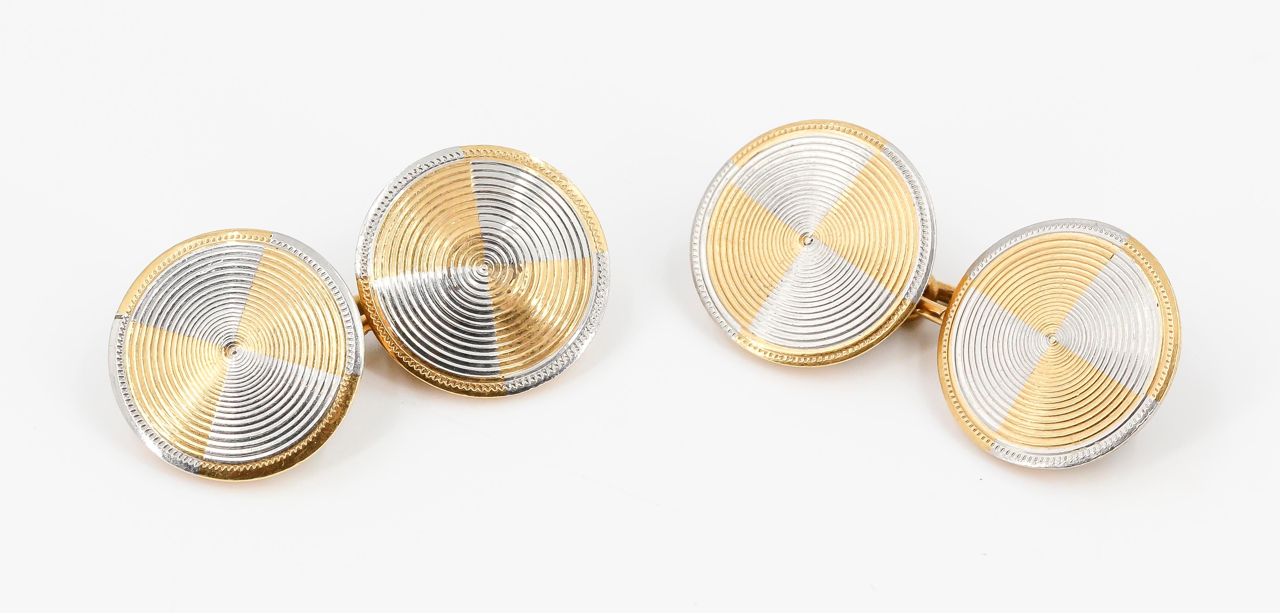 Handsome 18K white and yellow gold engine turned cufflinks from the Art Deco era, imported into France.

Hallmarks: French 18K gold import mark.