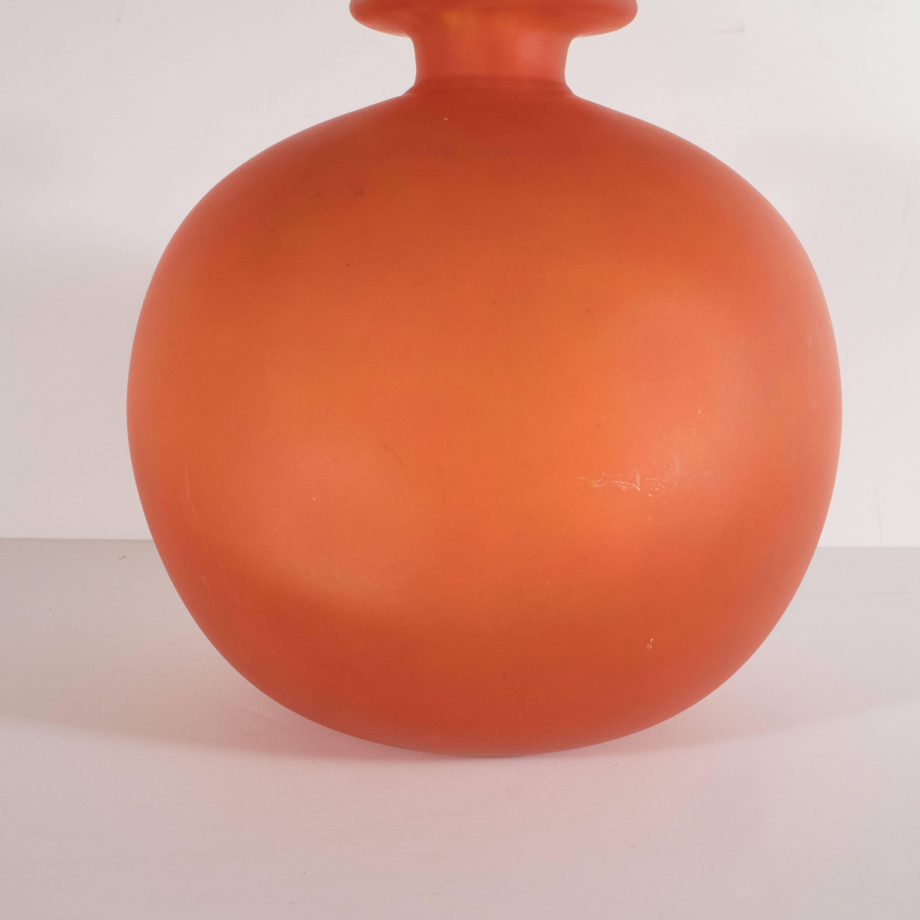This beautiful Art Deco vase was handblown by Charles Schneider one of the most illustrious glass blowers of the period in France, circa 1930. It features an orbital body with a cylindrical neck that expands outwards to a circular bobeches style