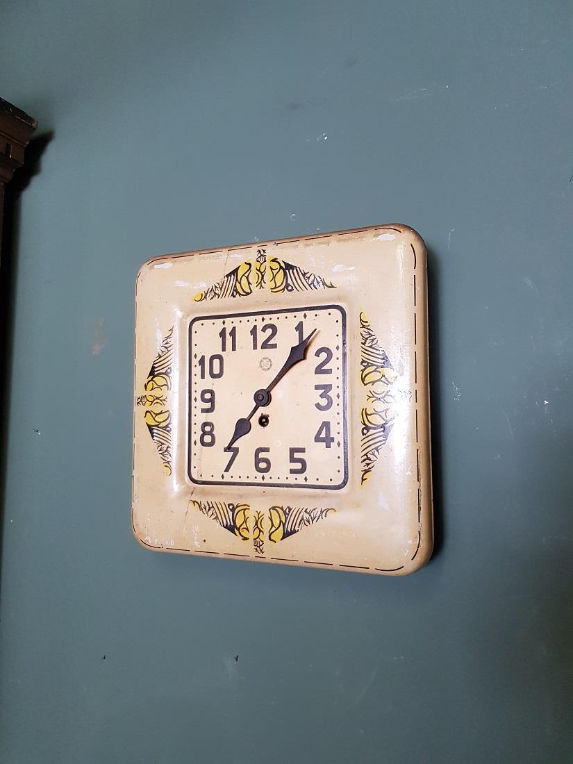 Old French metal Art Deco wall clock made by the firm Manufacture Française d'armes and the Cycles Saint Etienne including key, in a reasonable and running condition. Originating from the 1920s and 1940s.

The measurements are,
Depth 7 cm/ 2.7