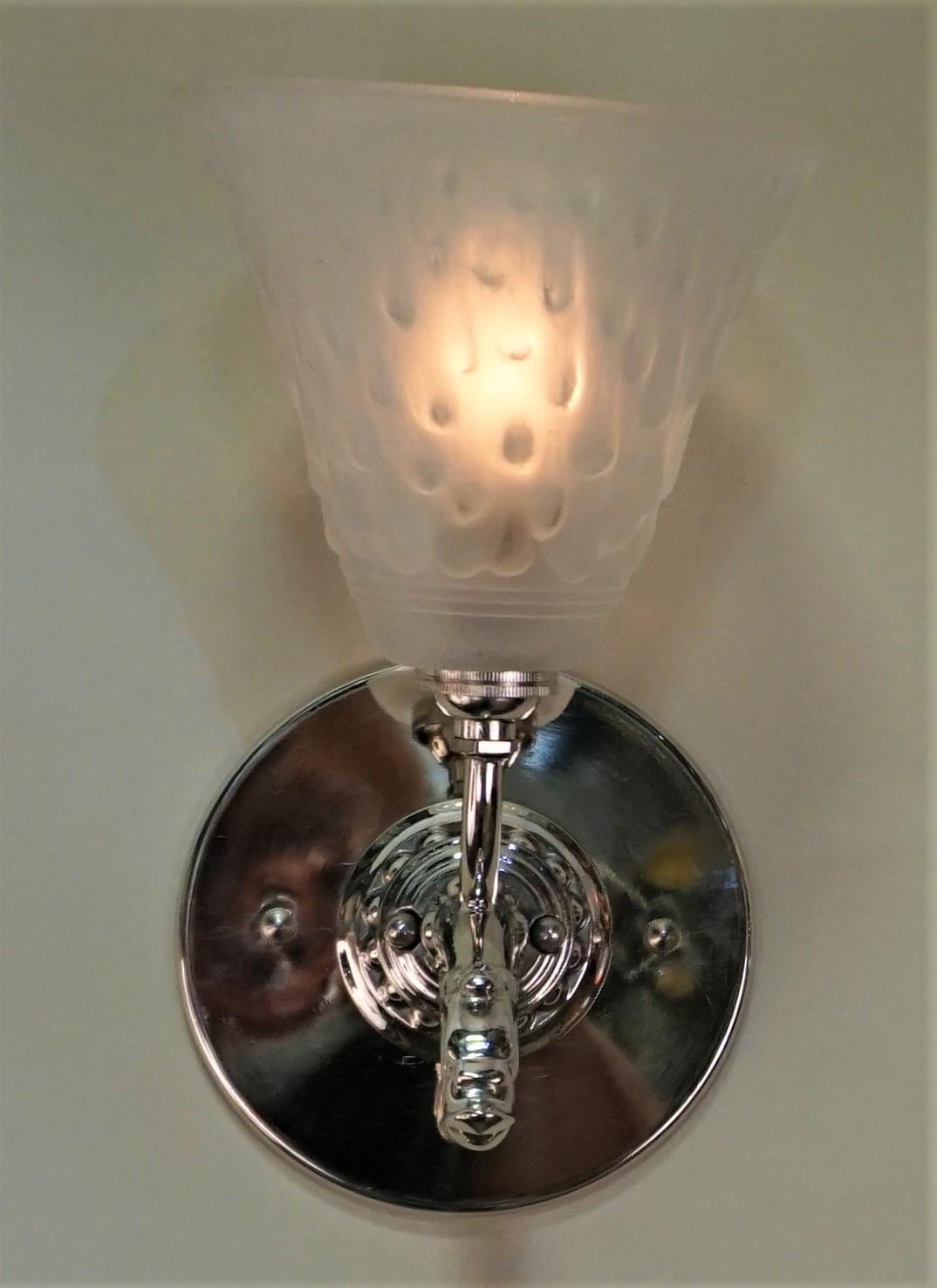 Pair of clear frost glass with nick on bronze frame Art Deco wall sconces.