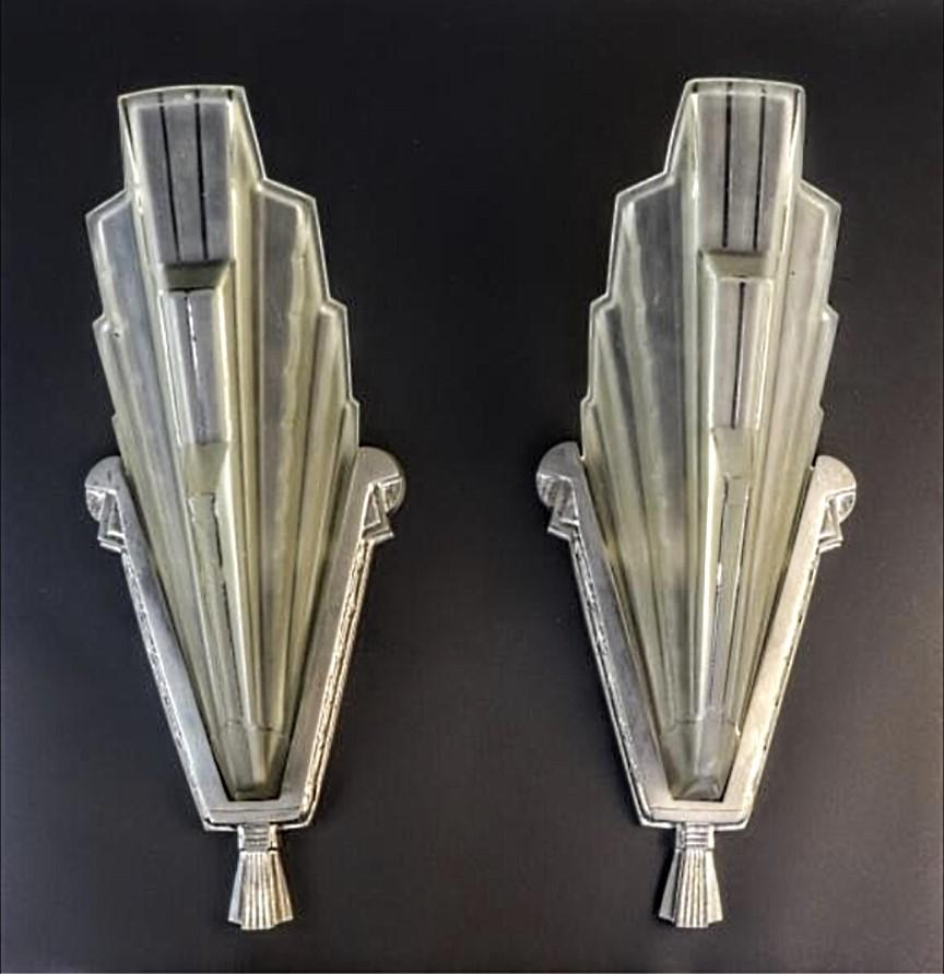 A pair of French Art Deco wall sconces created by the French artist 