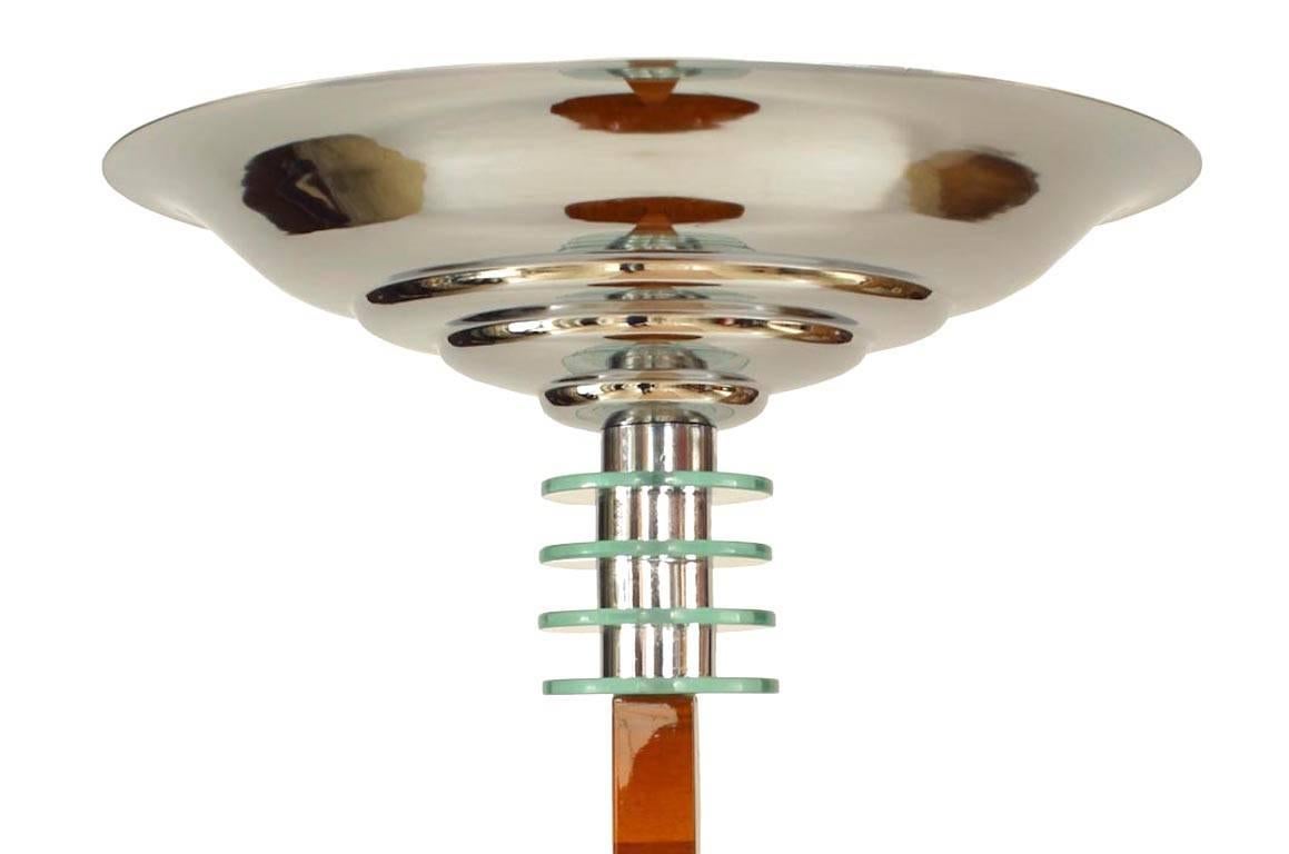 French Art Deco walnut floor lamp with round table top, shelf, and base with a square center post ending in a chrome uplight with 4 glass rings.
