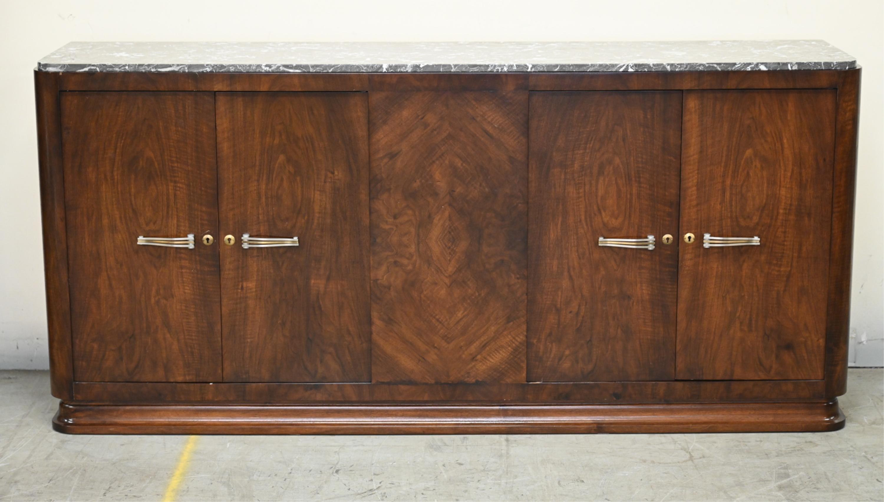 A magnificent French Art Deco sideboard was made in the 1930's. Walnut four doors with stunning grain pattern throughout with grey-veined marble top. Two-tone deco designed handles (can be replated in other finishes) The inside has plenty of storage
