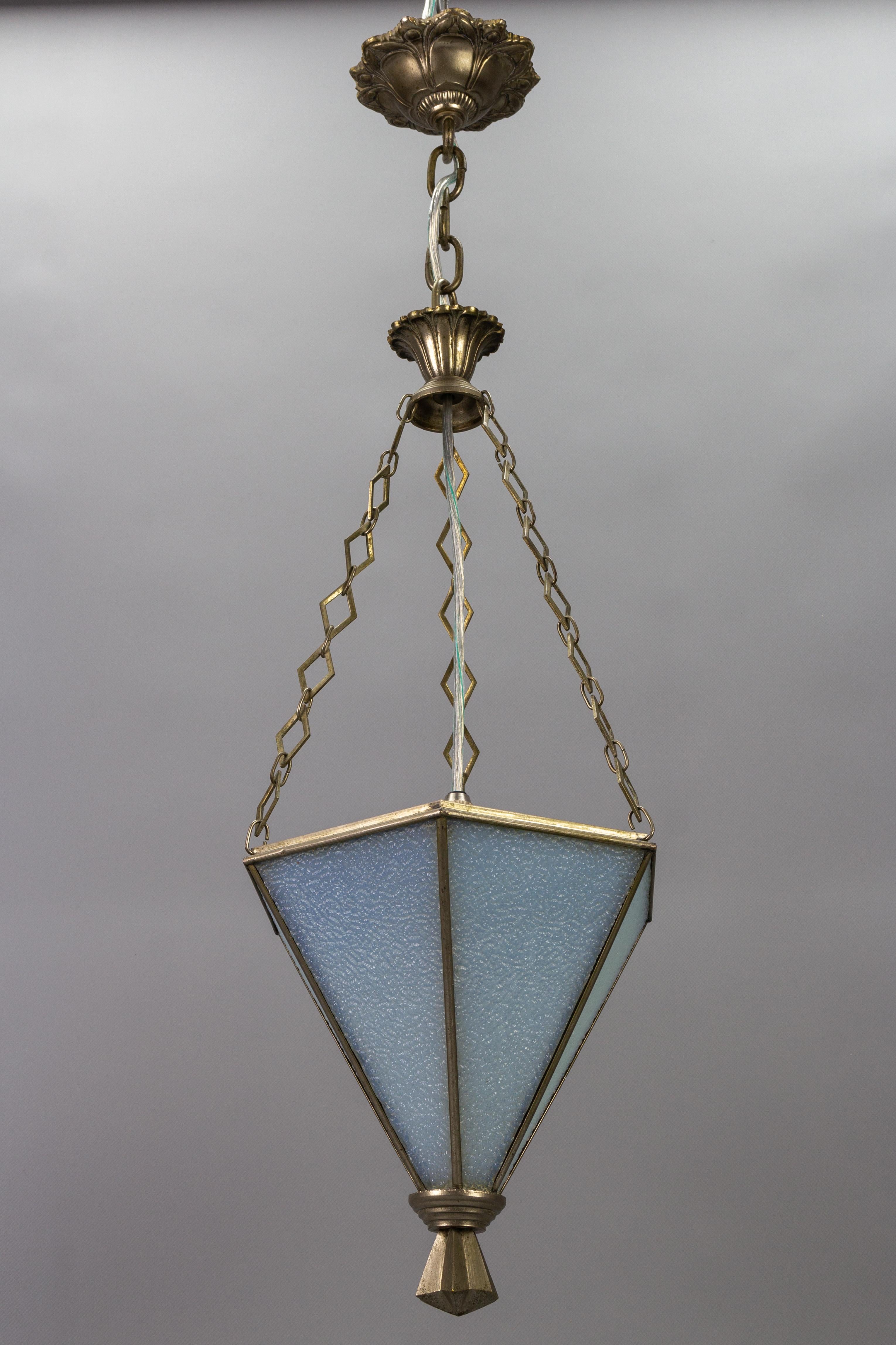 Wonderful French Art Deco pendant light with silver color brass hexagonal light fixture frame and six white frosted texture glass panels.
One socket for the E14 size light bulb.
Dimensions: height: 72 cm / 28.34 in; diameter: 24 cm / 9.44 in.
The