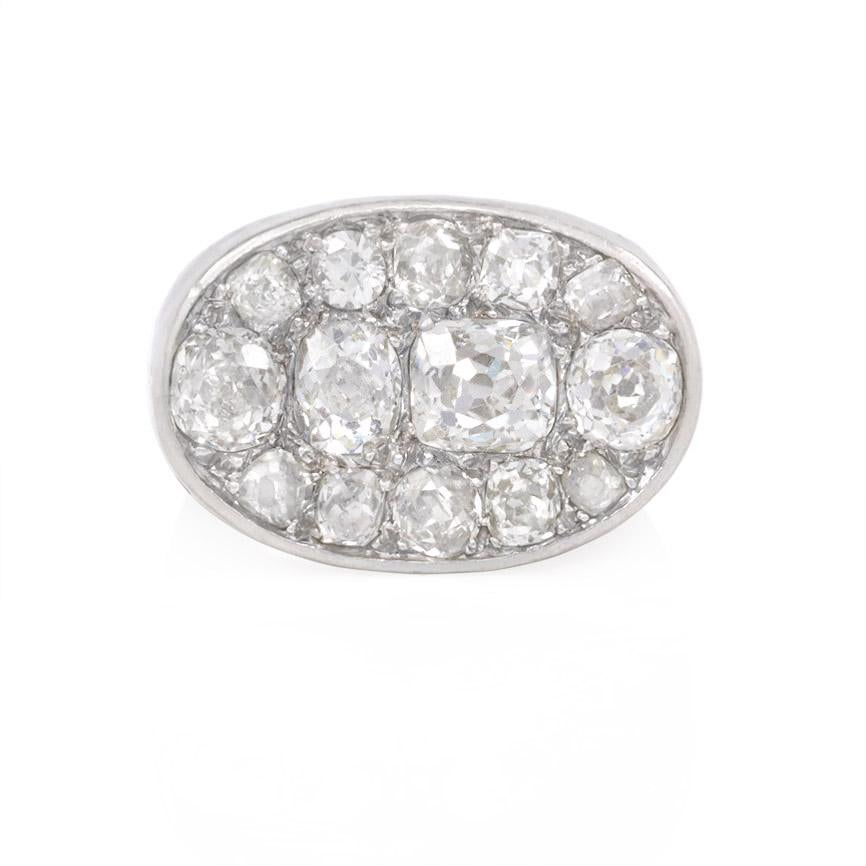 An Art Deco ring inset wth an oval pavé panel of old mine cut diamonds in platinum and 18k white gold.  France.  Atw 2.24 cts.

Top dimensions approximately .65