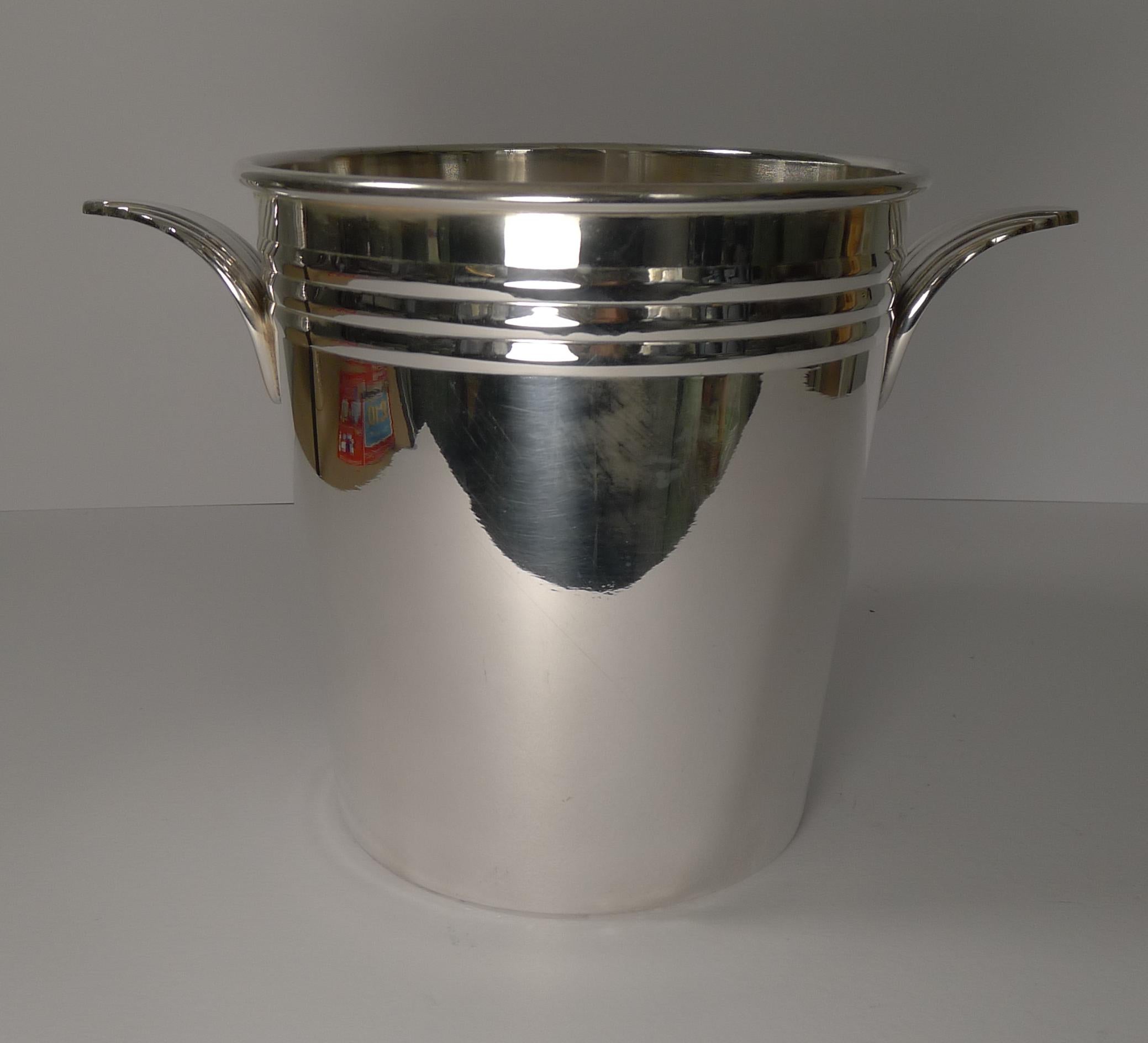 A stunning Art Deco wine cooler with fabulous Art Deco handles. Just back from our silversmith's where it has been professionally cleaned and polished, bringing it back to life.

Dating to the 1930s it remains in excellent condition with minor