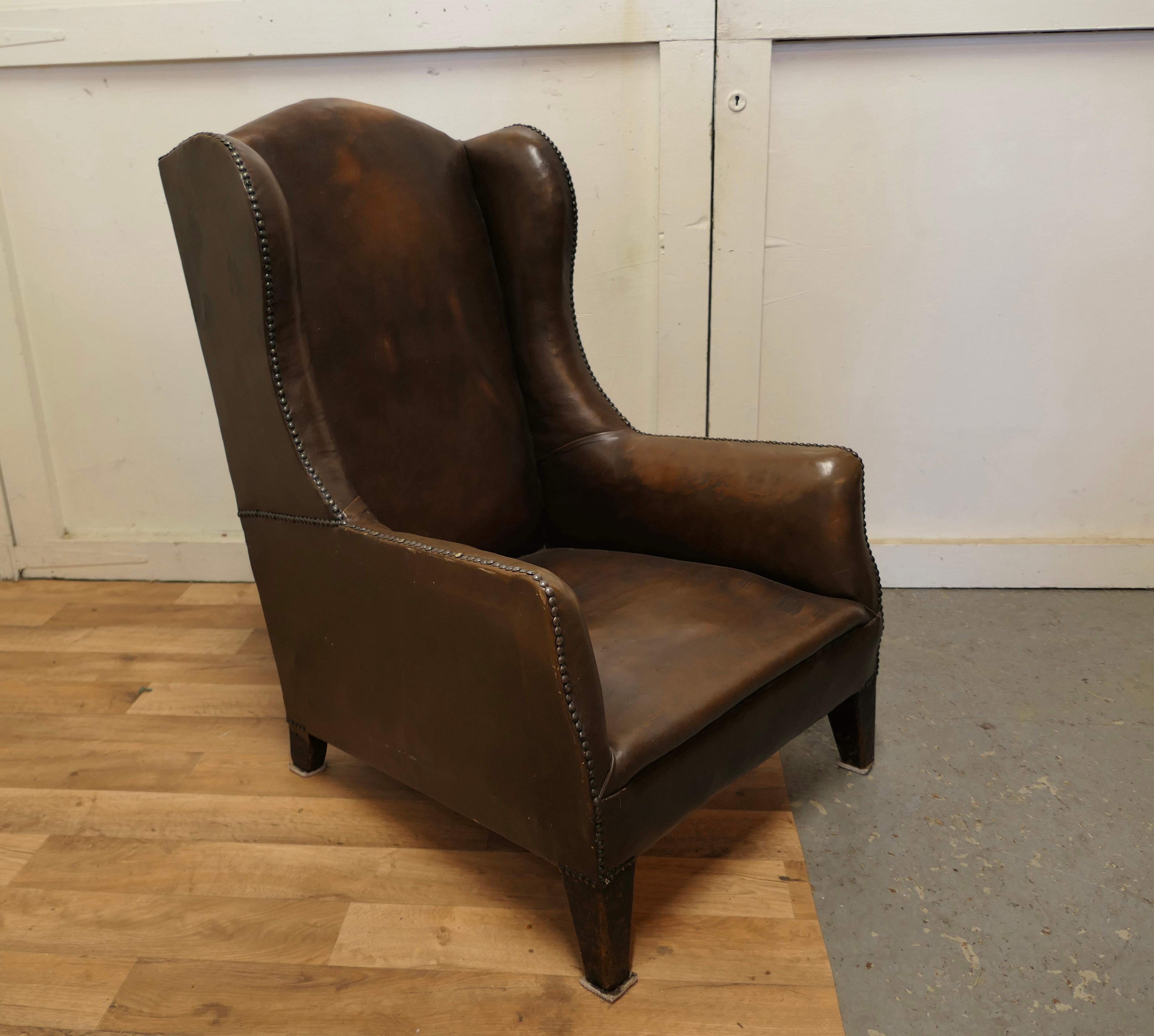 French Art Deco wing back chair, in dark brown leather 


The old leather hide is in good condition, it has a beautiful soft feel having been polished many times over the years and it has been well loved and well taken care of 
The chairs has