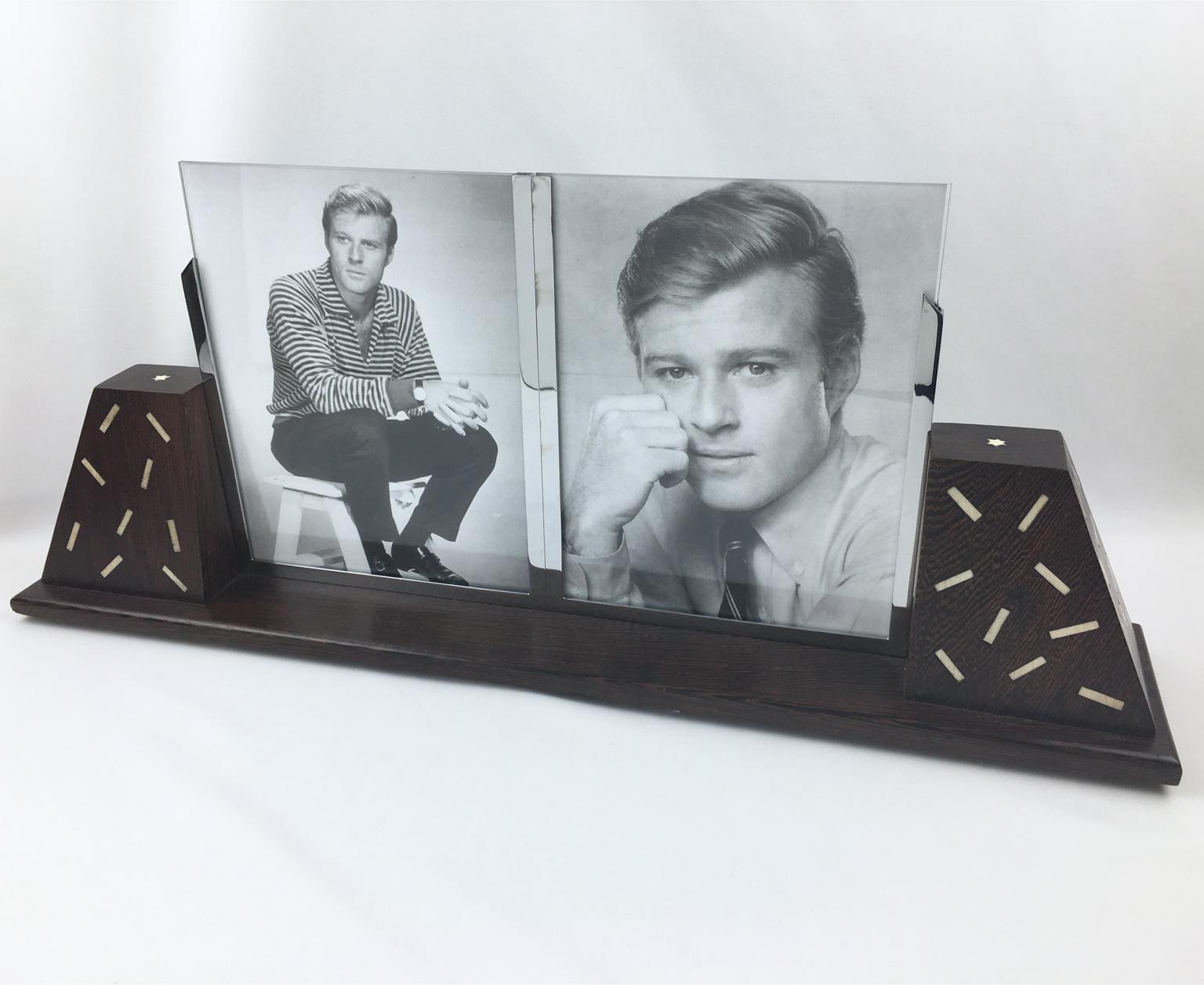 This impressive French Art Deco double view picture photo frame features a thick hand-rubbed wood plinth complimented with two extra-large side holders in the same wood with off-white Galalith embedded detailing. The frame has chromed metal holders