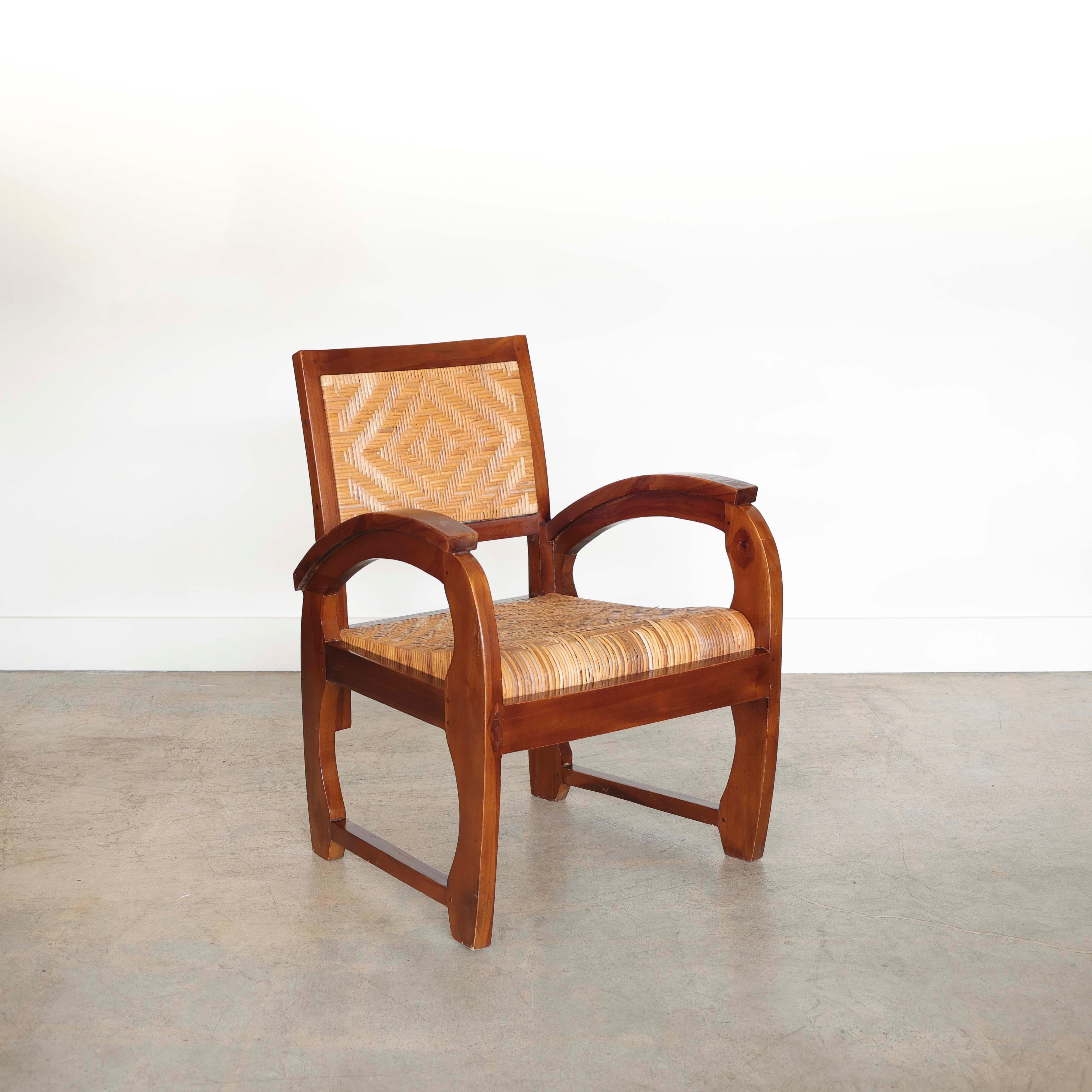 Wonderful Art Deco wood and woven armchair from France, 1930s. Beautiful curved carved wood arms and legs. Original woven rattan seat and back. Original finish shows great age and patina. 