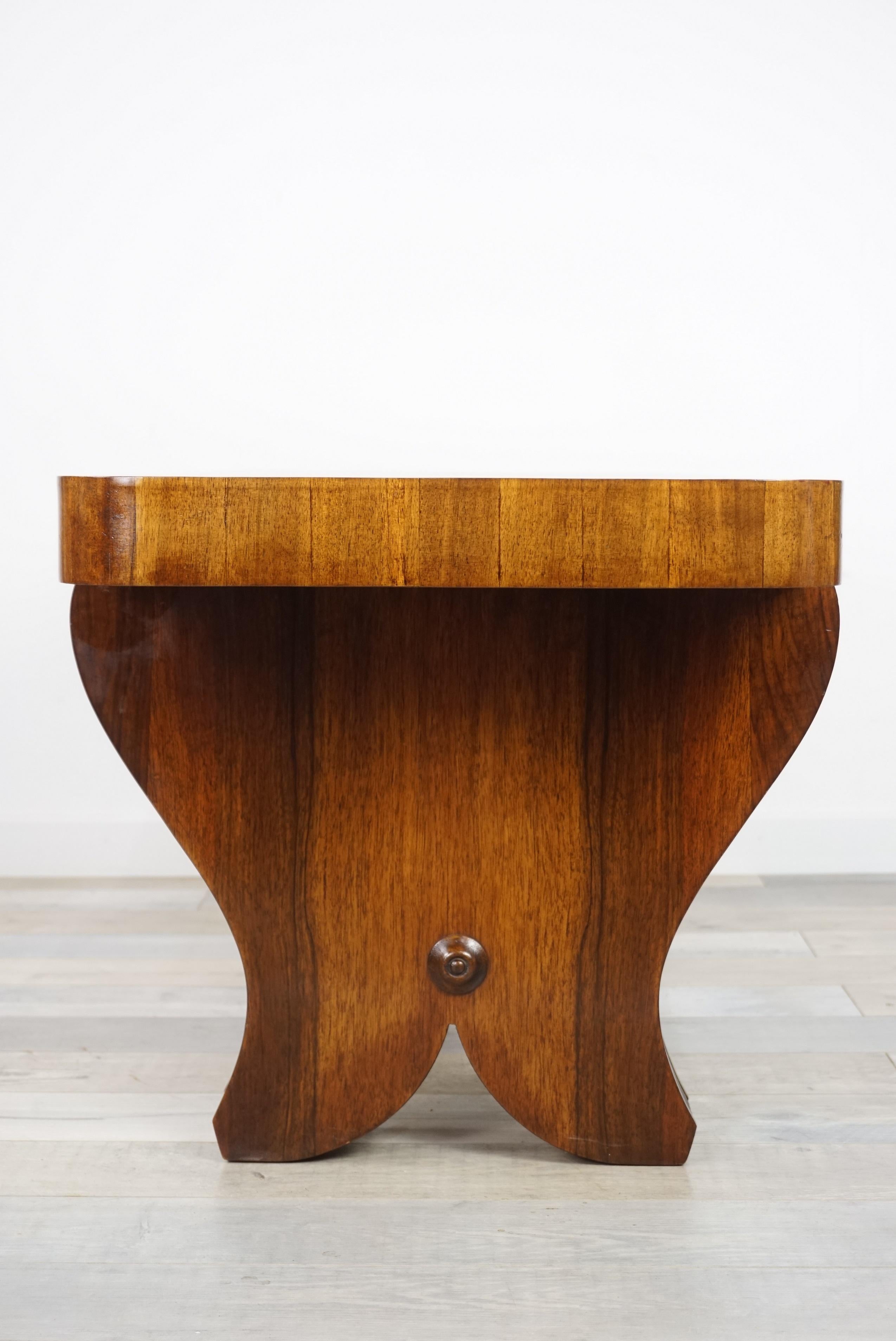 French Art Deco wooden coffee table from the beginning of the 20th century, elegant, curvaceous and rounded. In very good state.