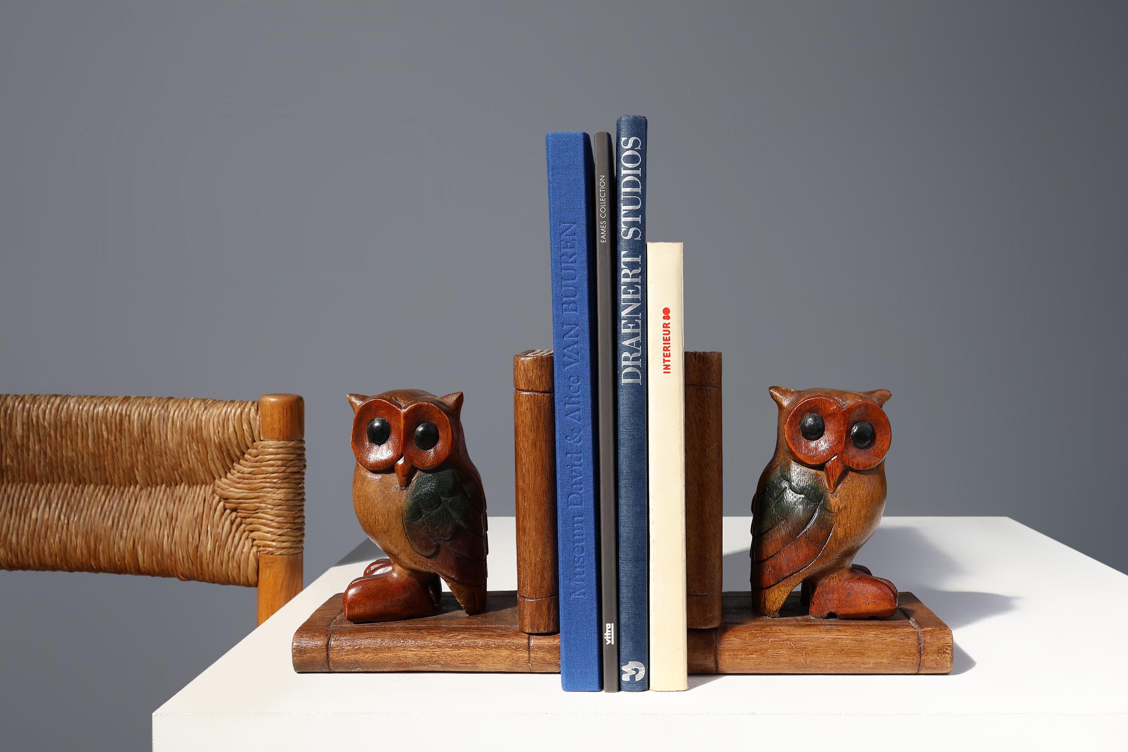 France / 1920 / pair book-ends / wood / Art Deco / Mid-century / Vintage
 
Beautiful wooden owl bookends, handcrafted in the 1920s in France. These bookends each feature a carved and painted owl sitting on a book with a book standing next to them.