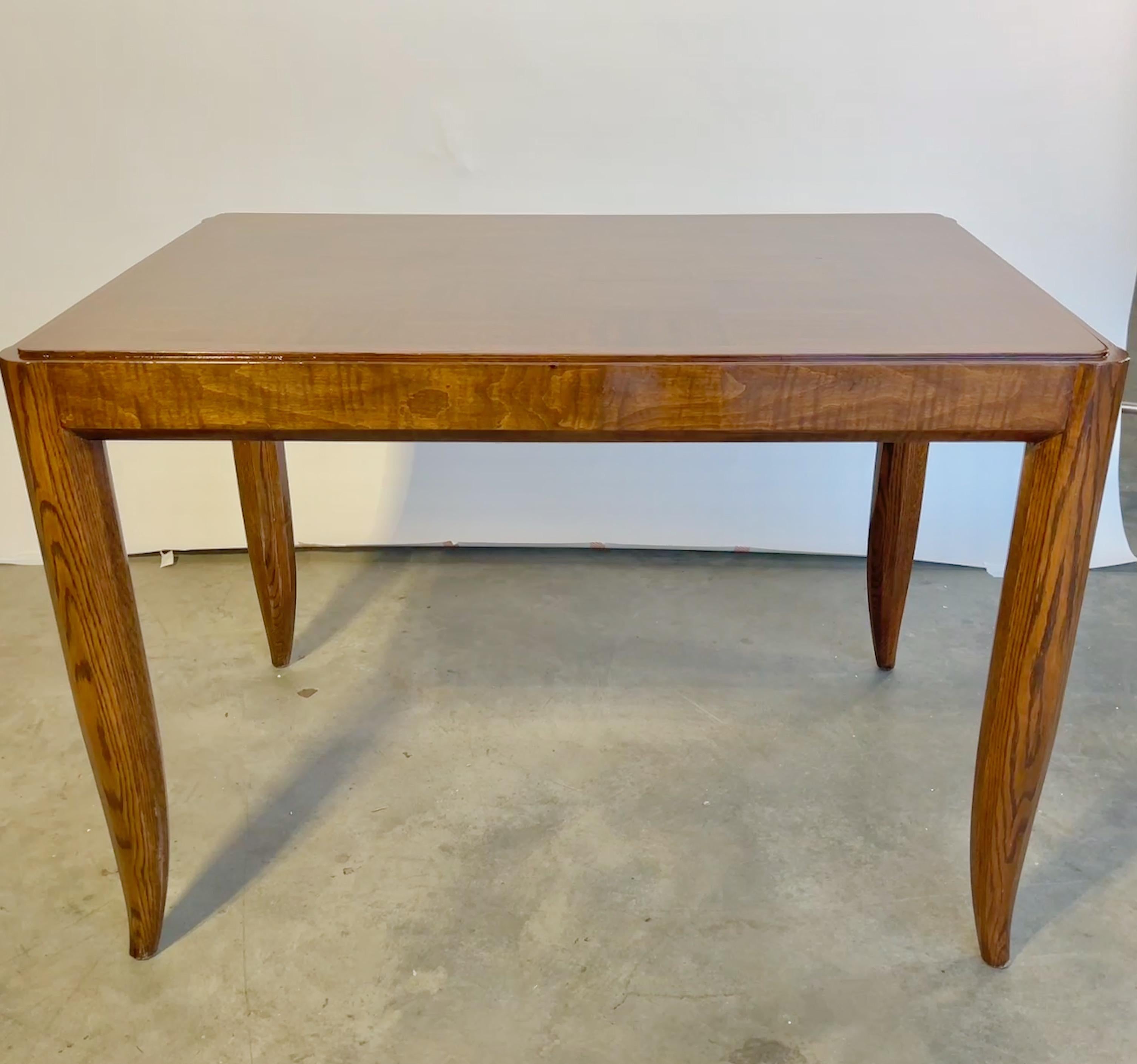 French Art Deco writing table or desk with two side drawers, maple parquet top, rounded (subtly octagonal) oak legs with elegant feet, in clear gloss finish. In the style of Andre Domin & Marcel Genevriere for Maison Dominique.
It also bears a