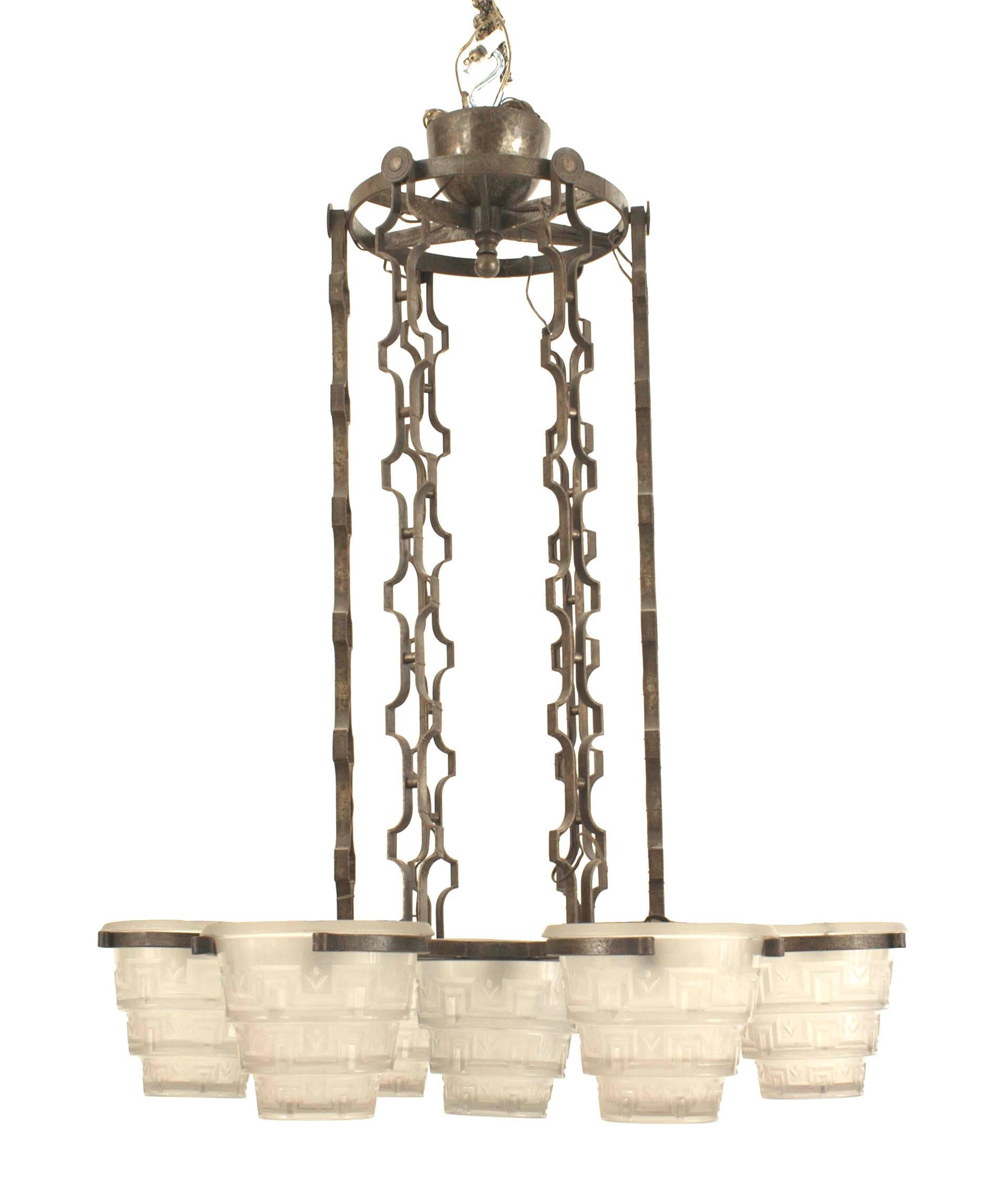 French Art Deco (circa 1930) wrought iron chandelier with 6 arms holding tiered conical glass shades (by Muller) emanating from a center shade & suspended by chains (Attributed to Edgar Brandt).
 