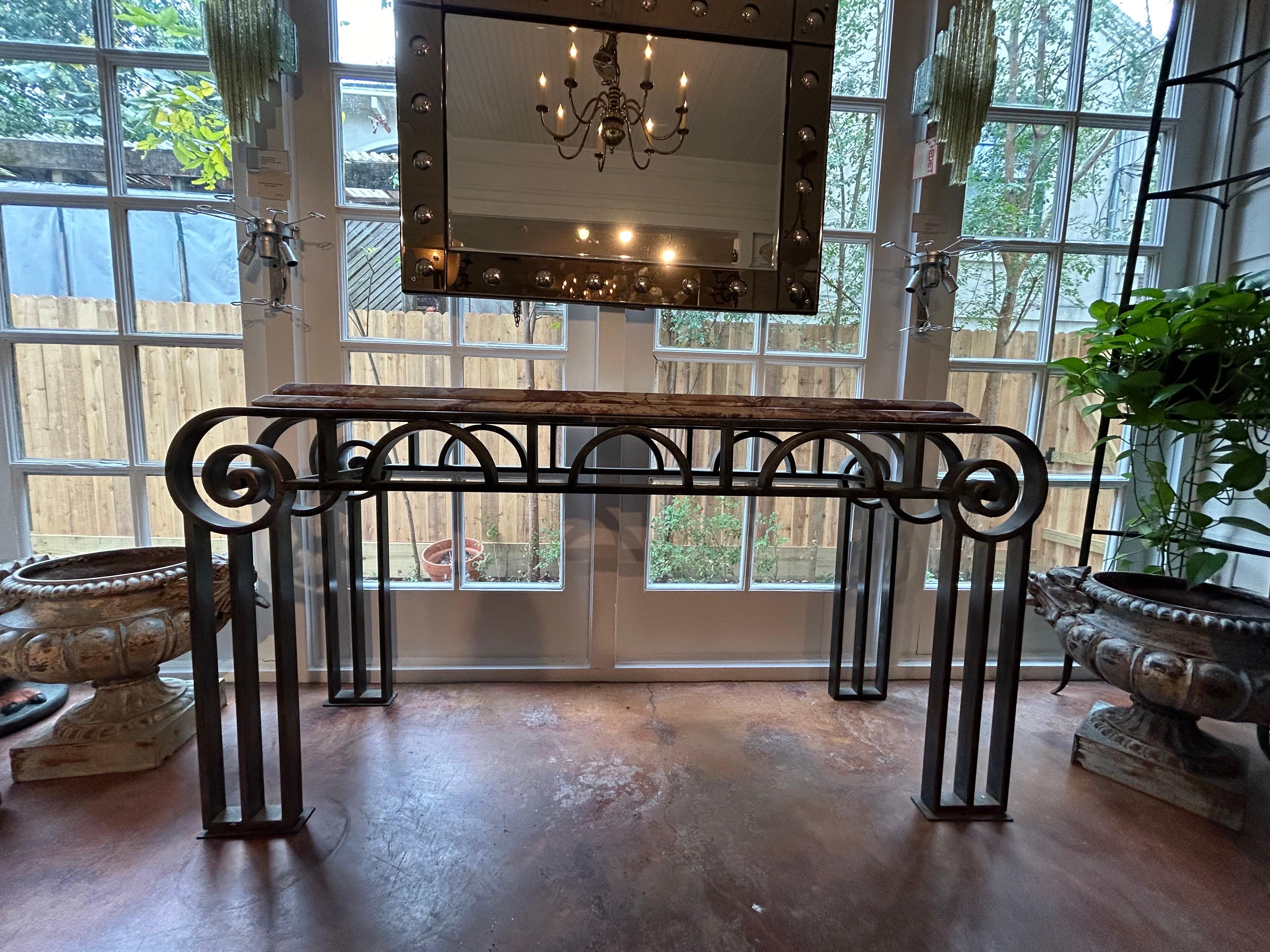 French Art Deco Wrought Iron Console Table.
Offered French console table is very heavy gauge hand forged iron with the original stepped marble top. This versatile French console is decorated on all sides which is perfect for floating in a room as a