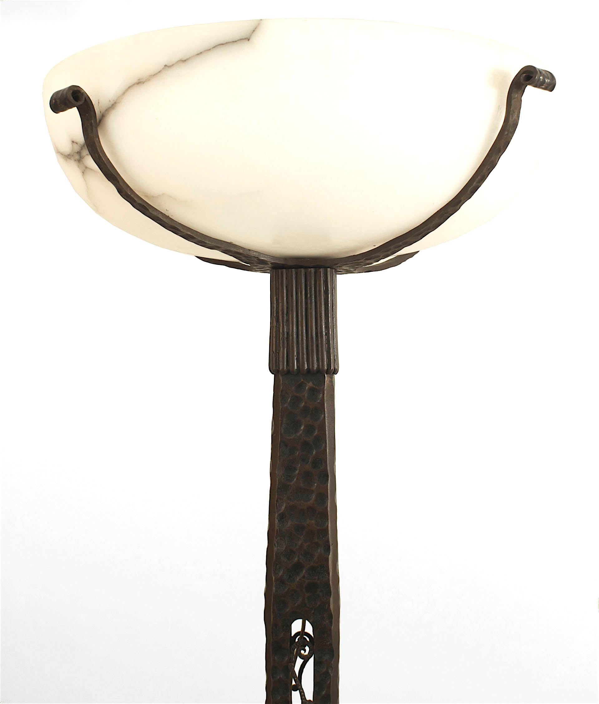 French Art Deco (c. 1930) wrought iron floor lamp with an open square shaft and floral fluted top supporting an alabaster bowl (att: Paul Kiss).


Paul Kiss was a French artist famous for his art deco ornamental ironwork, producing excellent quality