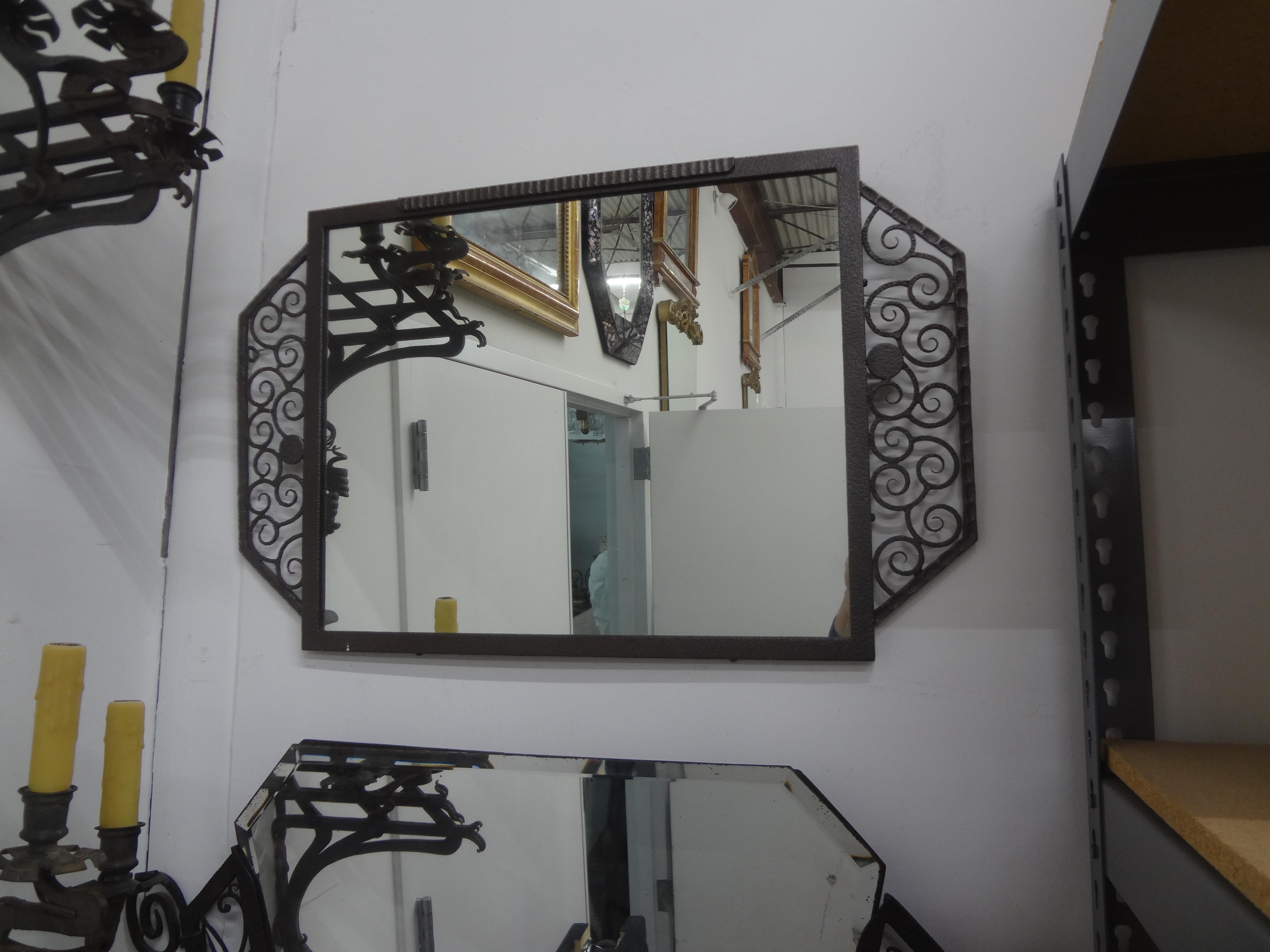 French Art Deco Wrought Iron Mirror.
Handsome French Art Deco wrought iron mirror in the manner of Edgar Brandt, Raymond Subes, Paul Kiss and Michel Zadounaïsky. 
This classic French iron mirror is the perfect size for a powder room