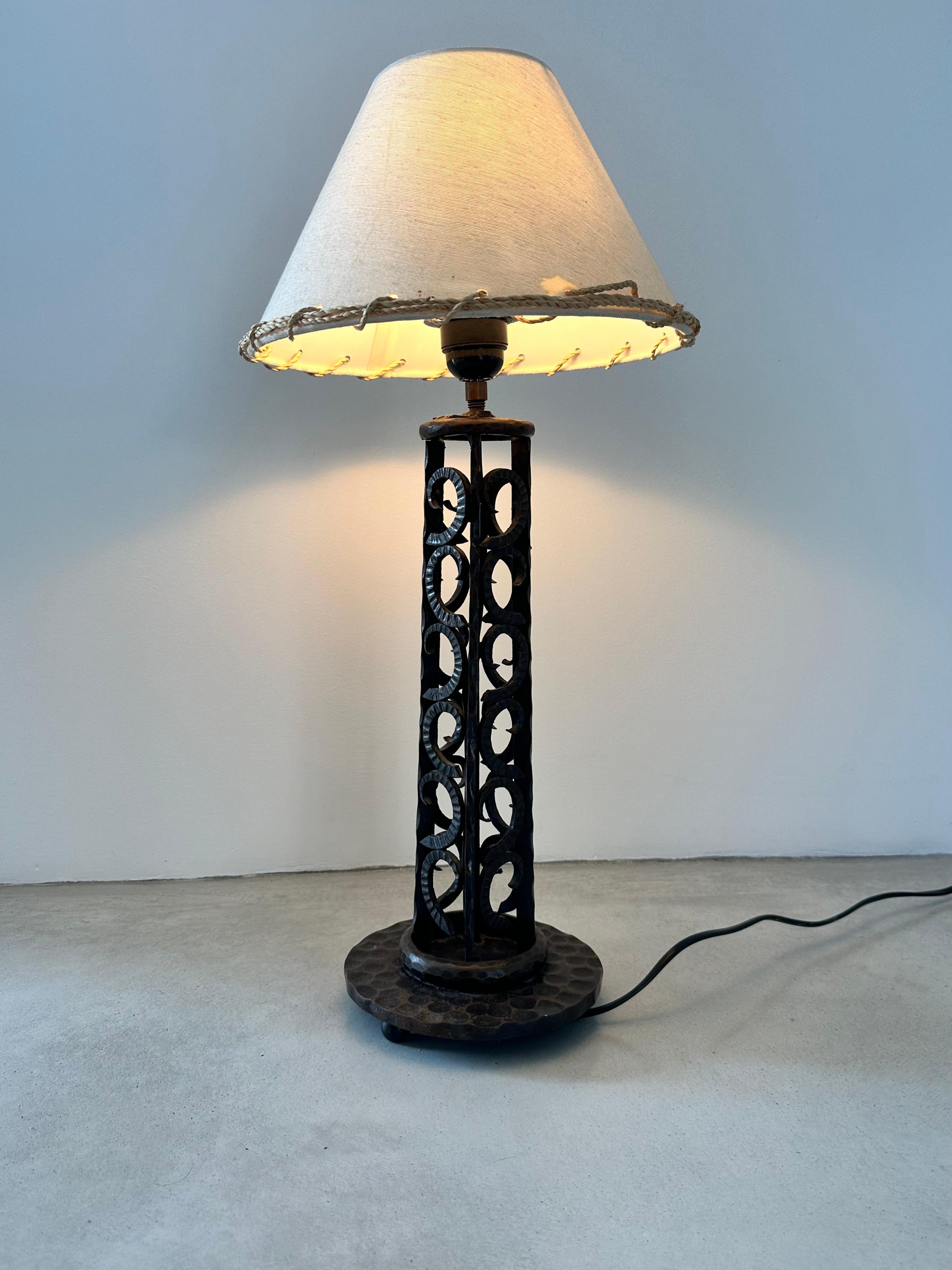 French Art Deco Wrought-iron table lamp.

Beautiful handmade ironwork, very elaborate.

Height excluding lampshade 36 cm / 14,17 inch

Circular base with a diameter of 16 cm / 6,3 inch

For sale without the lampshade

Good Condition.

Circa 1930s