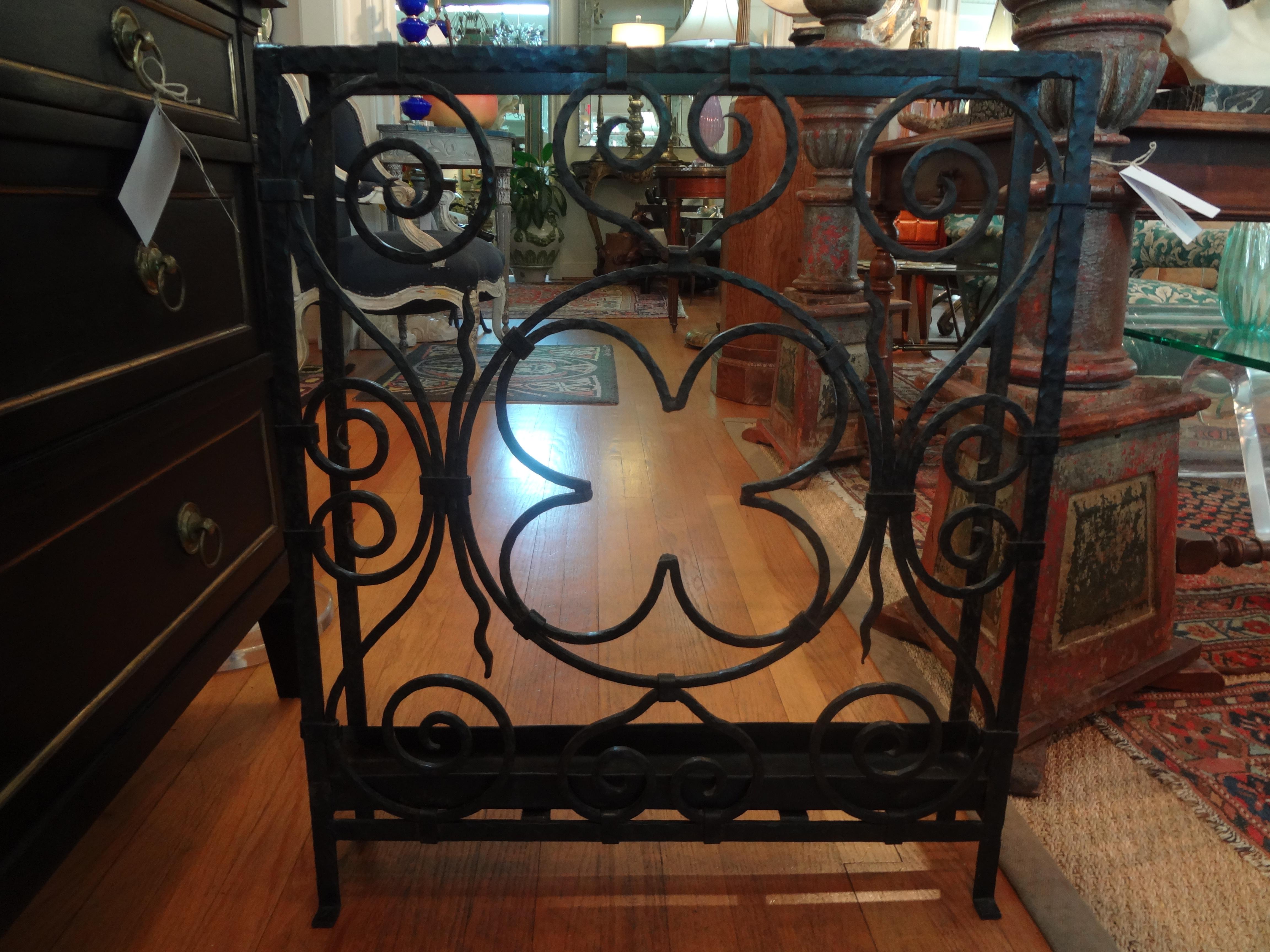 Stunning French Art Deco hand forged wrought iron umbrella stand. This stylized umbrella stand is both functional and gorgeous. This French Art Deco geometric umbrella stand in the style of Edgar Brandt retains the original drip pan and dates to the