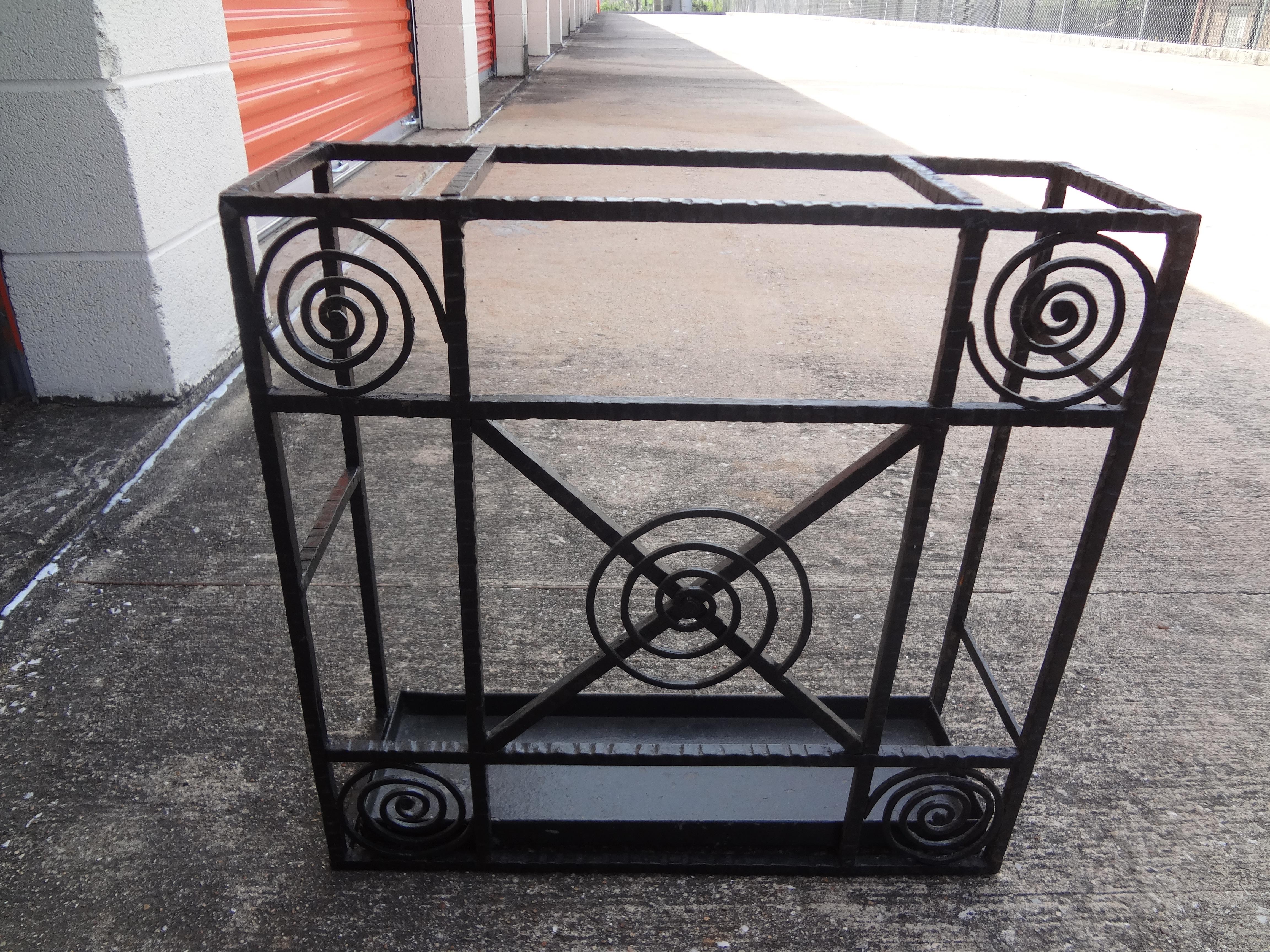 French Art Deco wrought iron umbrella stand.
This great French Art Deco black umbrella stand would look perfect at the entrance of your home! The interesting geometric pattern has been hand forged and is made of wrought iron. This gorgeous Edgar