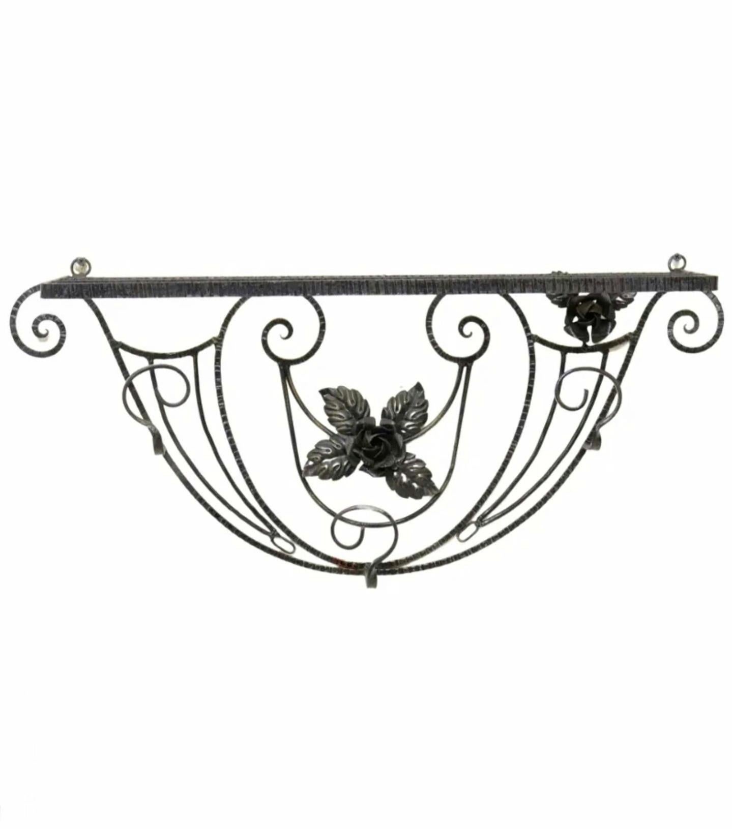 An original French Art Deco period black wrought iron wall hanging hall shelf (hat rack - coat hanger), in the manner of iconic Art Deco ironworker Edgar Brandt (French, 1880-1960)

France, circa late 1920s / early 1930s, hand forged ironwork,