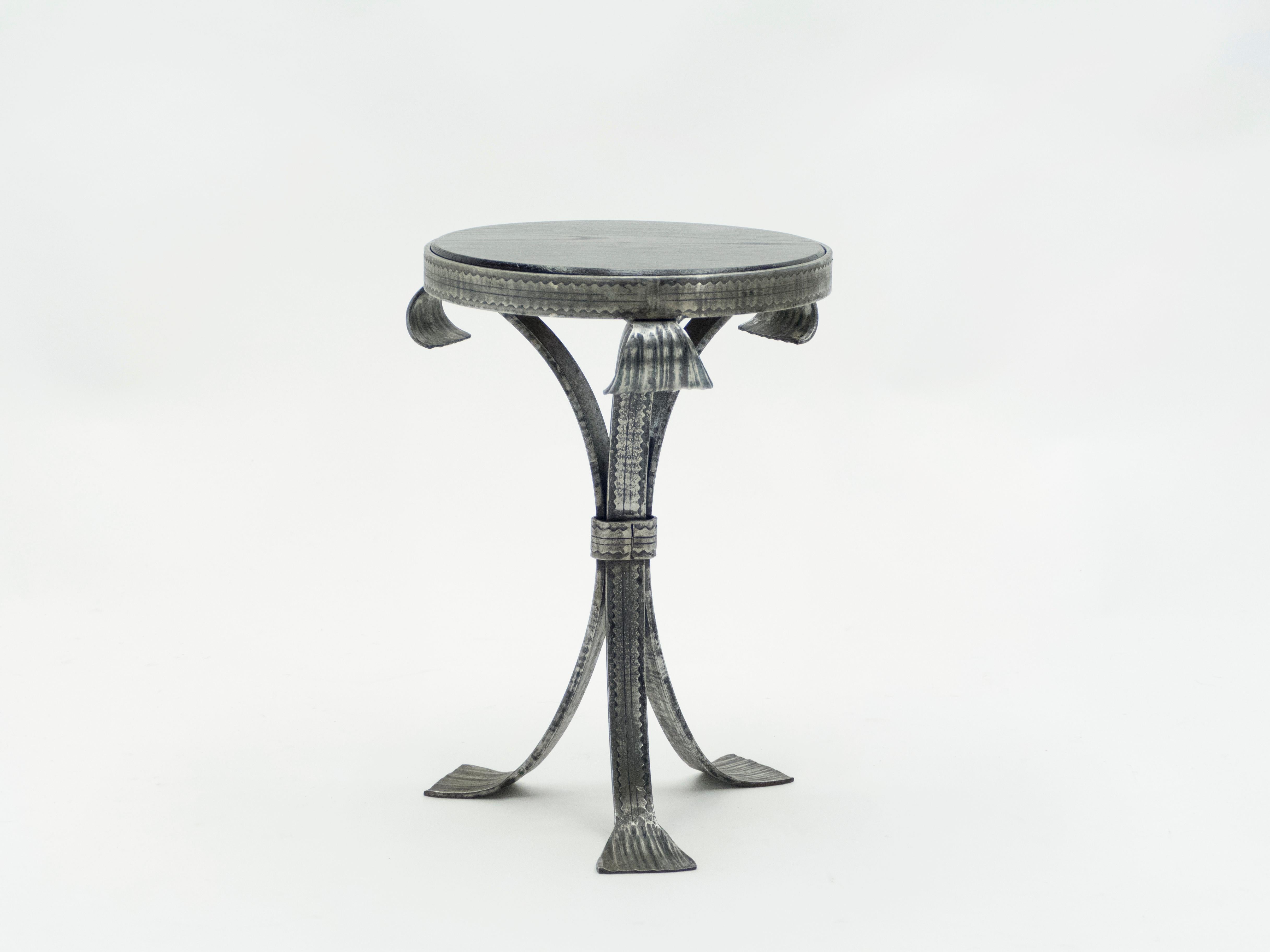 Hand produced in France in the early 1940s, this tripode gueridon features silky wrought steel legs with a beautiful rounded oak top. A perfect piece to use as an occasional table, end table, candle Stand, drinks table or smokers table. It looks