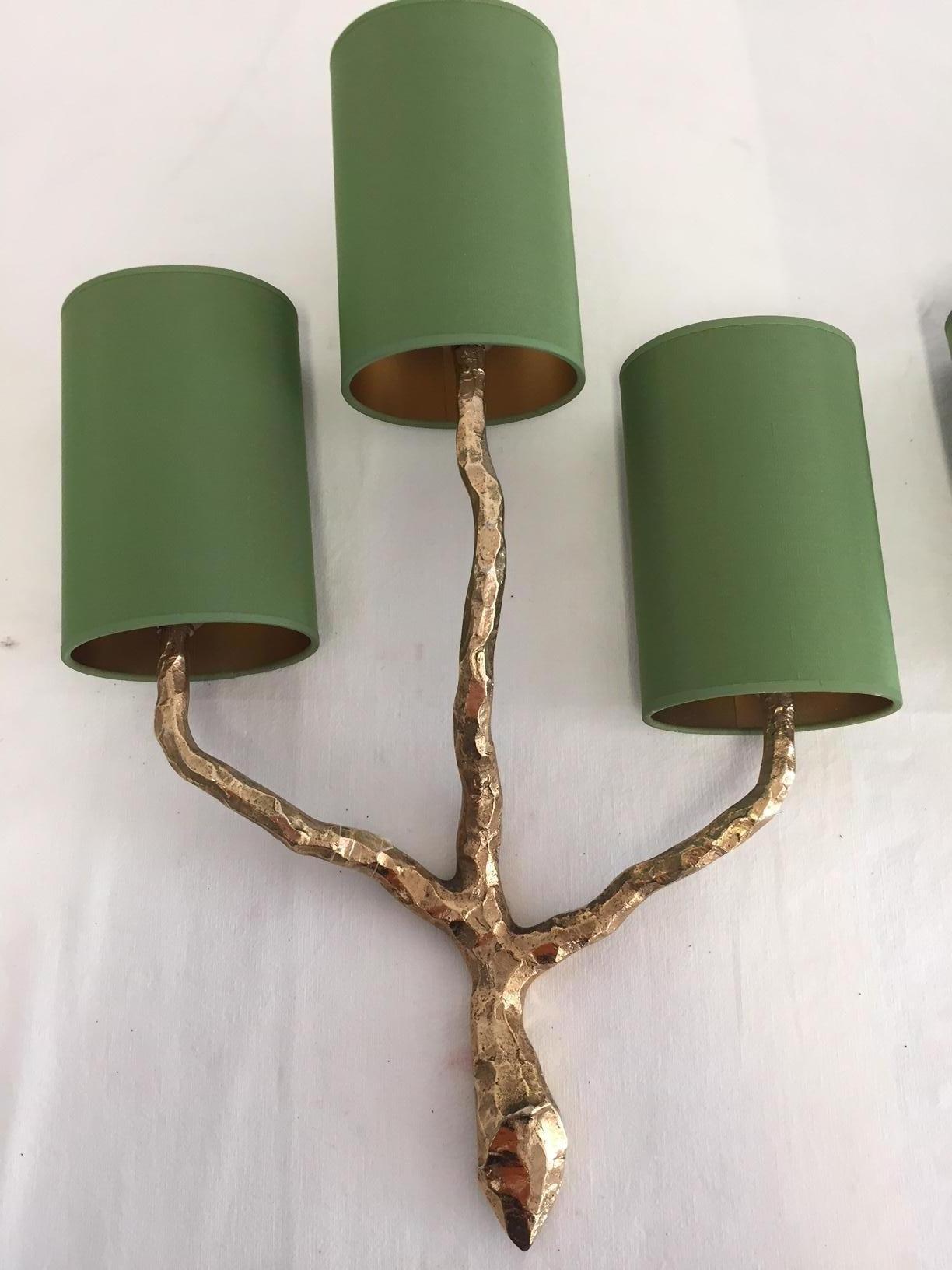 Pair of French Art Decorative bronze sconces by Maison Arlus from 1960.
Very good condition, wired in European standard, lamp shades in col. green silk inside with glossy gold lining

Measures: Height 51cm, width 34cm, depth 14cm.