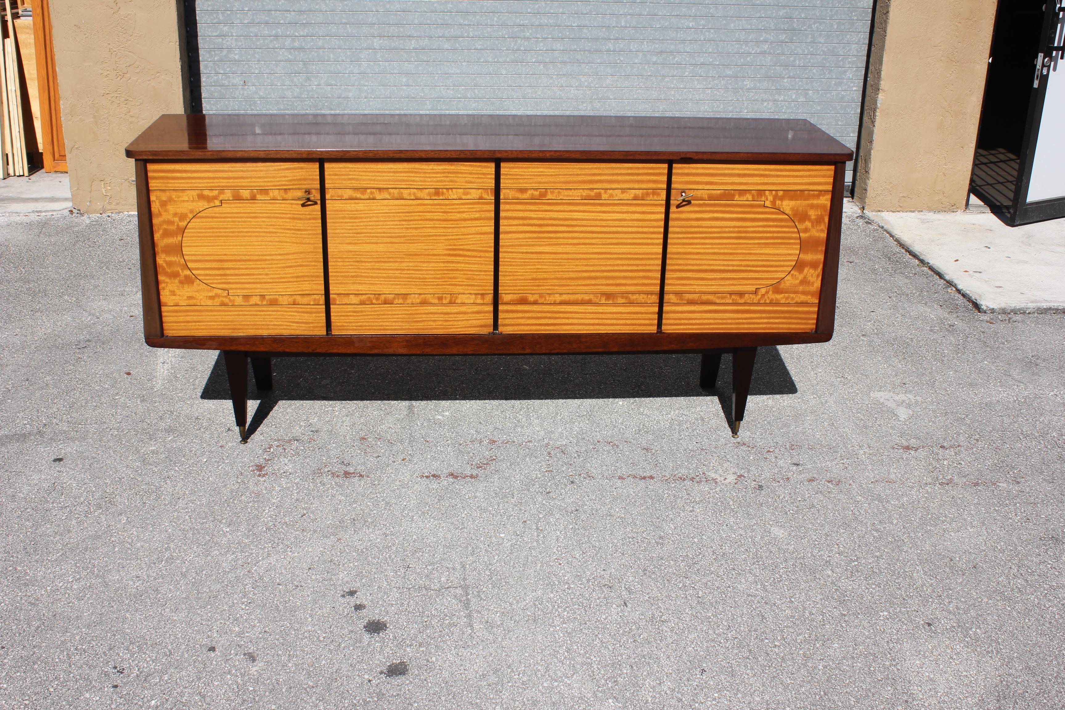 Beautiful French Art Modern Exotic Mahogany Sideboard / Buffet / Bar, the sideboard are in very good condition ,with dark mahogany wood and flame mahogany wood in the front doors ,With 2 drawers inside, with 3 shelves adjustable, And bar section